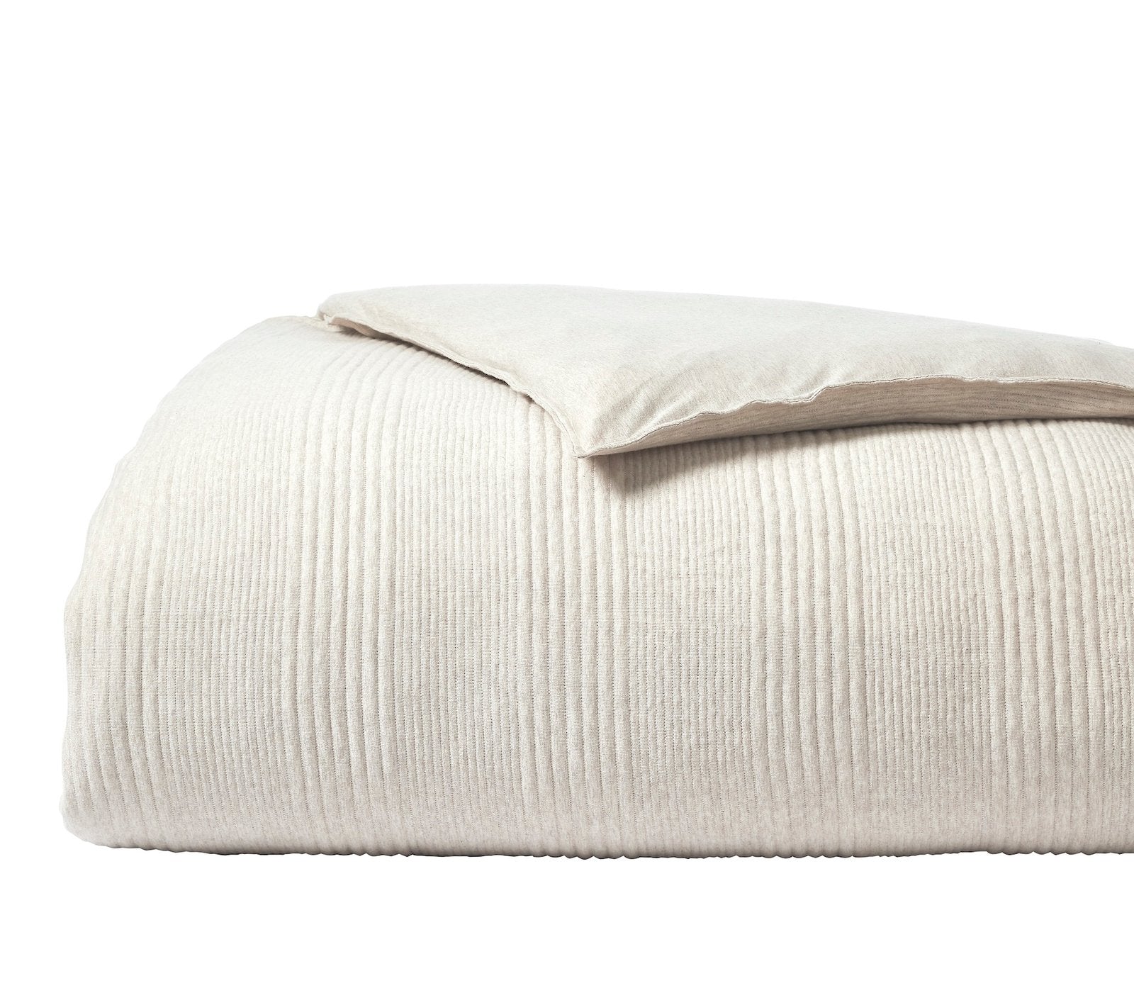 DT-040-10692_5|Clean beige textured duvet cover, vertically ribbed fabric, neatly folded with a matching pillow on top, simple elegance.