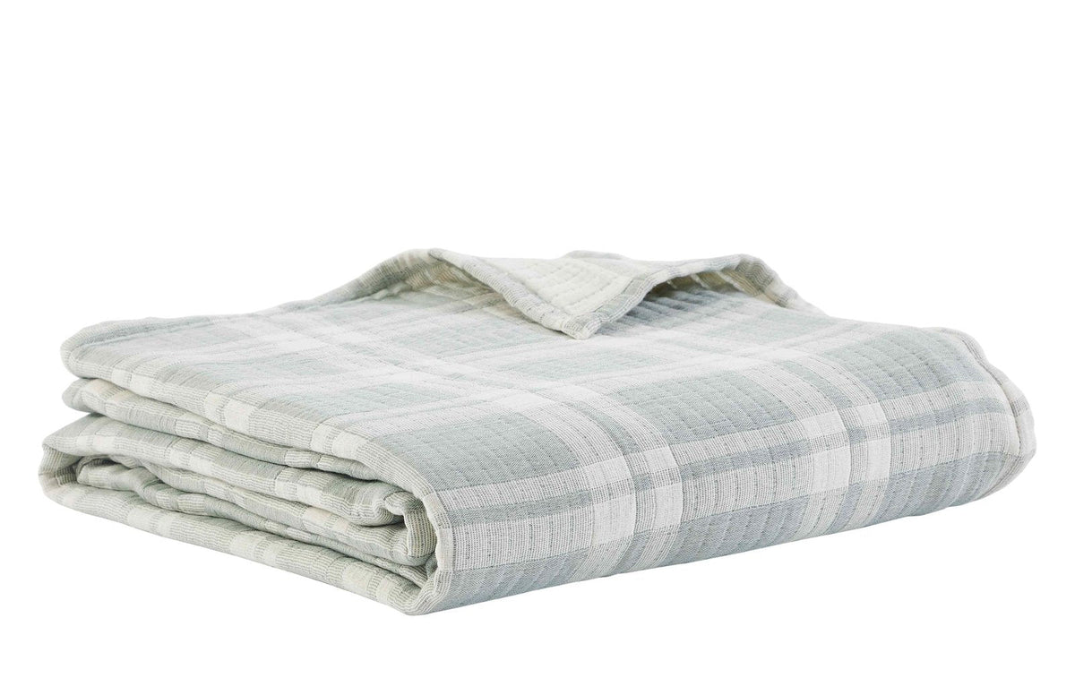 BT-119-9496_3|Neatly folded sage green and white plaid quilted blanket, showcasing its soft texture and inviting design for comfort.
