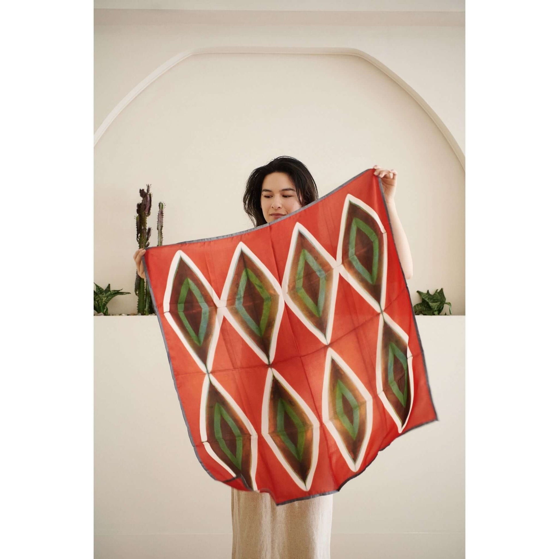 Fawn Square Silk Artisanal Scarf In Multicolor Hand Crafted Shibori Print displayed by a model.