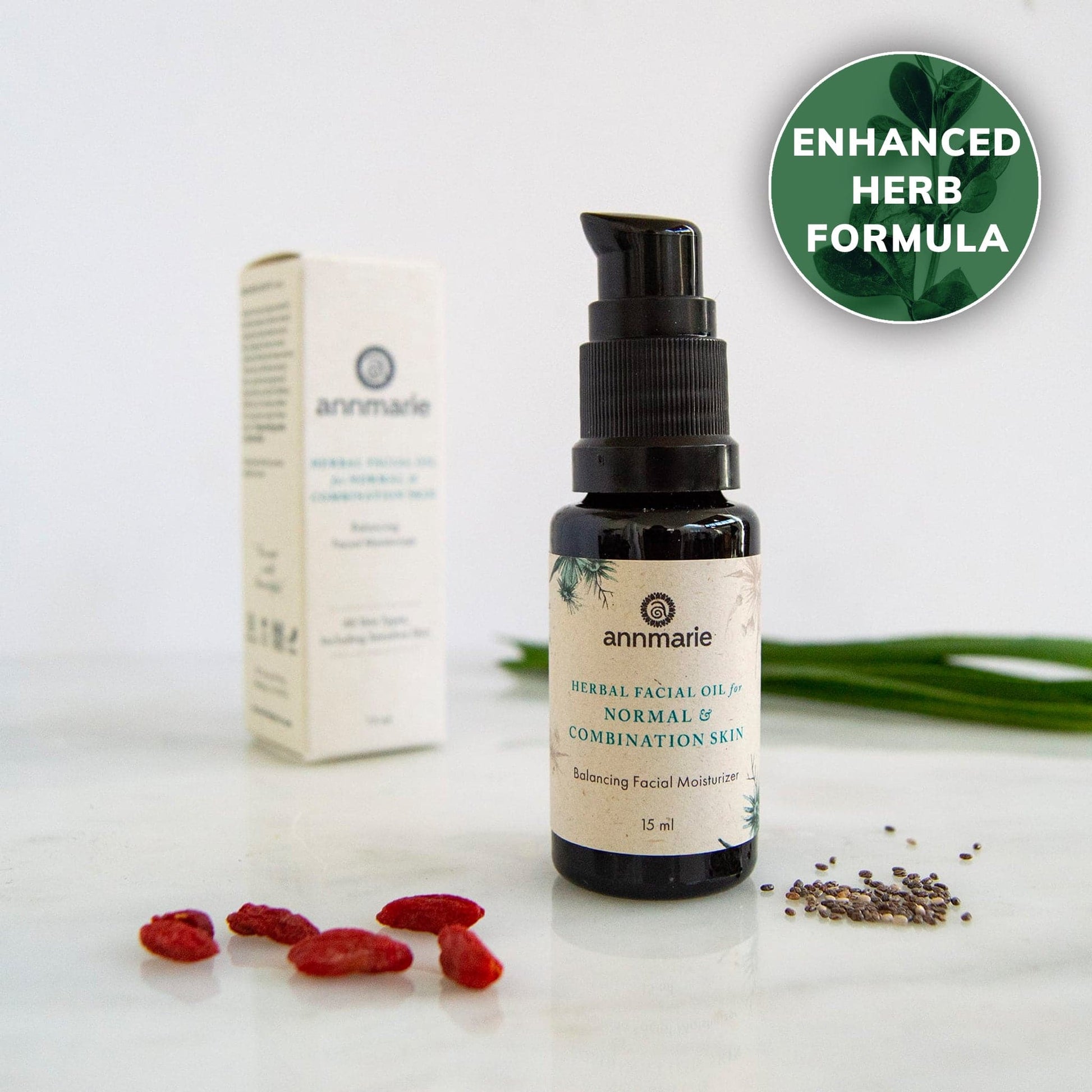 Herbal Facial Oil for normal and combination skin with enhanced herb formula, bottle with box and botanical ingredients.