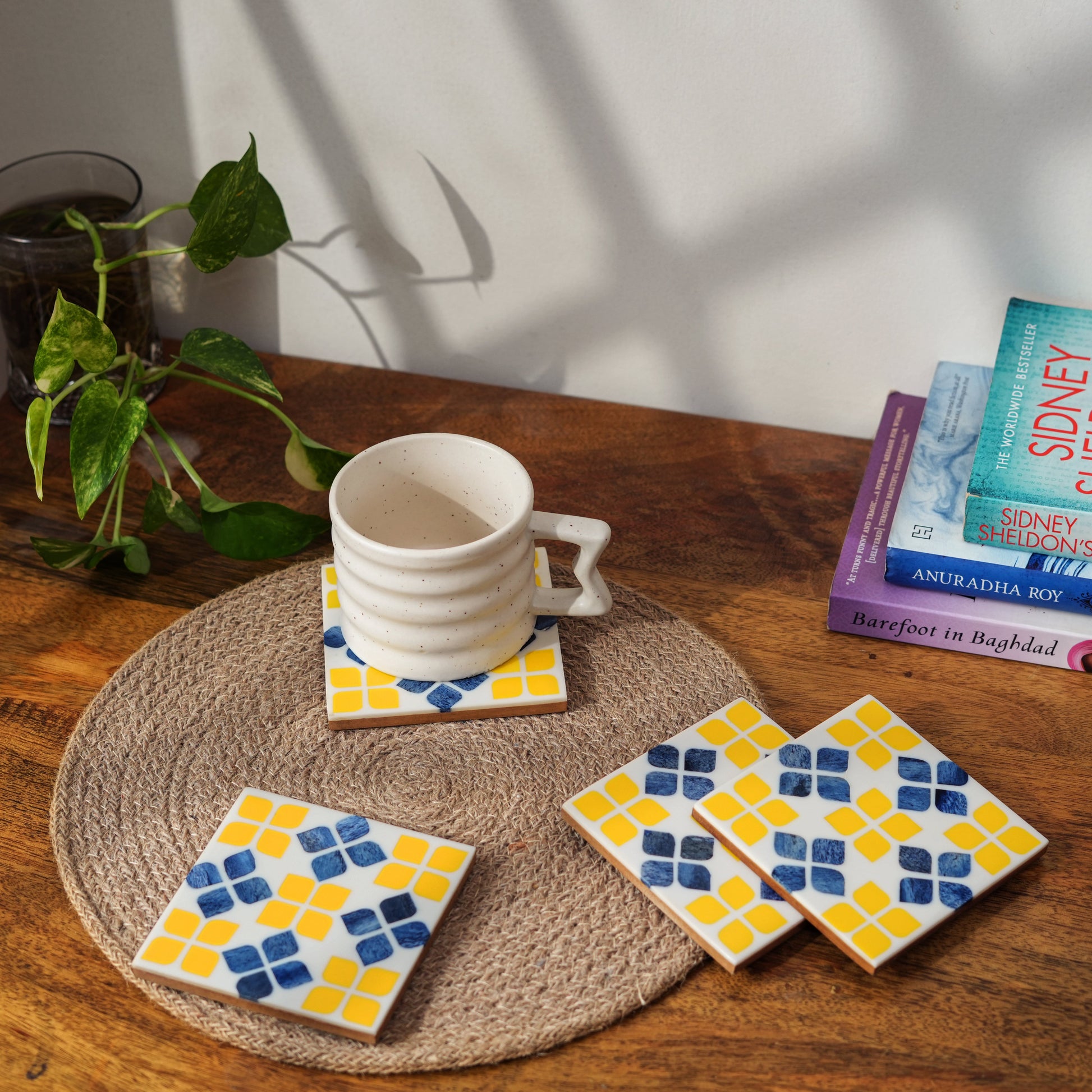 decorative yellow bone inlay coasters on coffee table with drinks