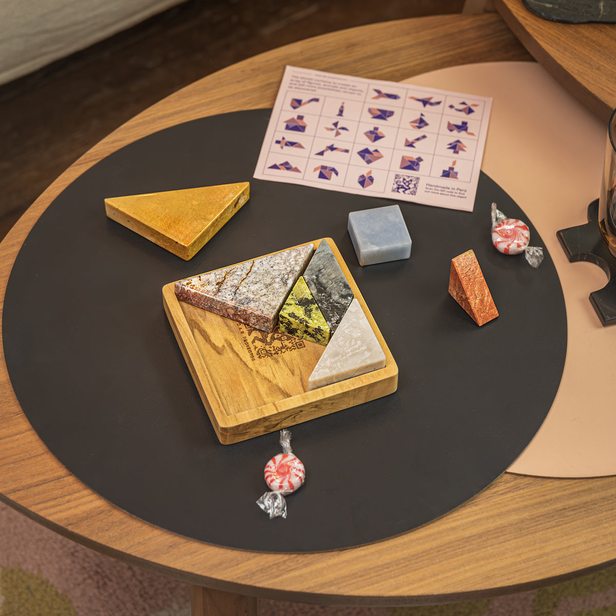 Natural stone Tangram puzzle styled as a luxurious interactive centerpiece.