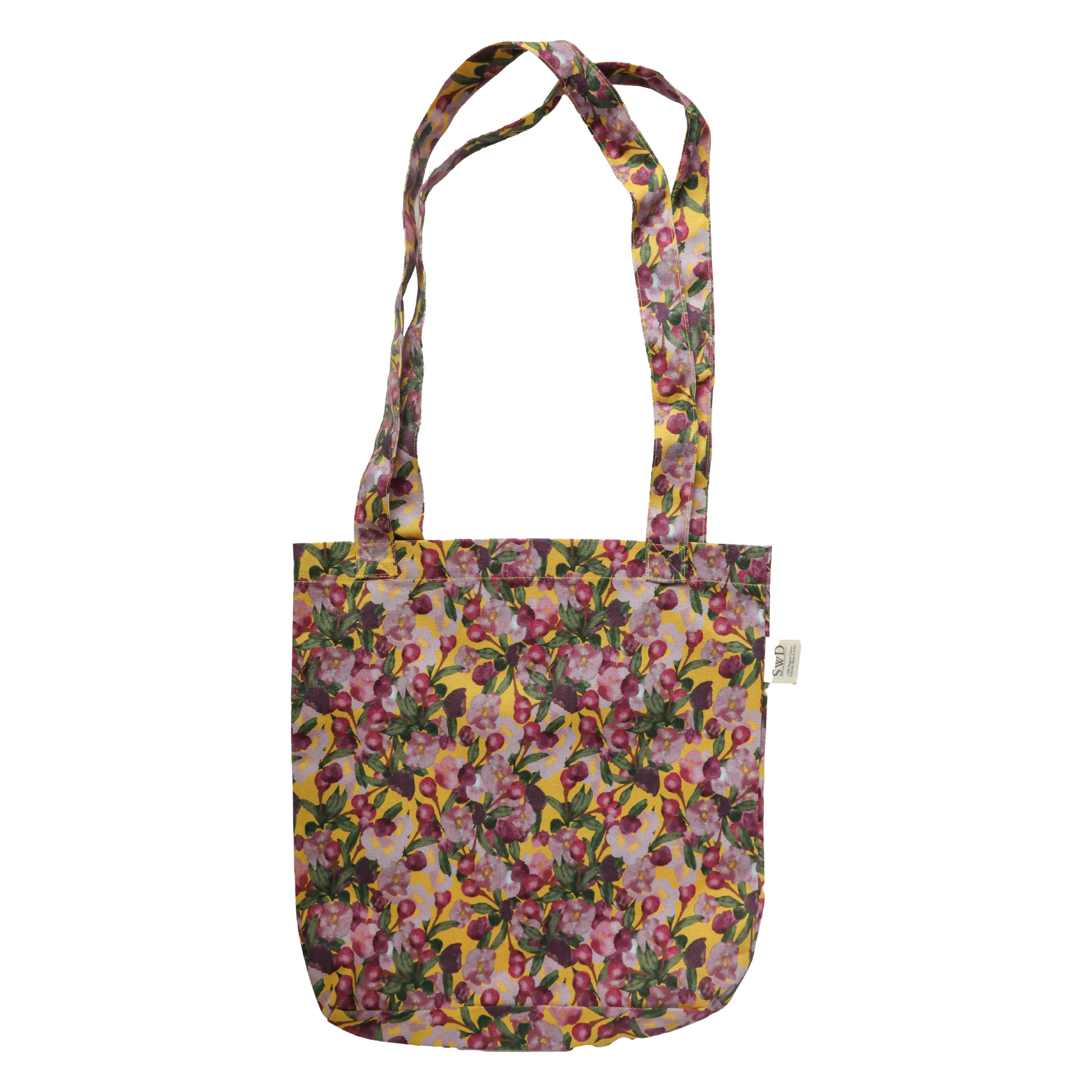 Pink Floral patterned tote bag on a Yellow background