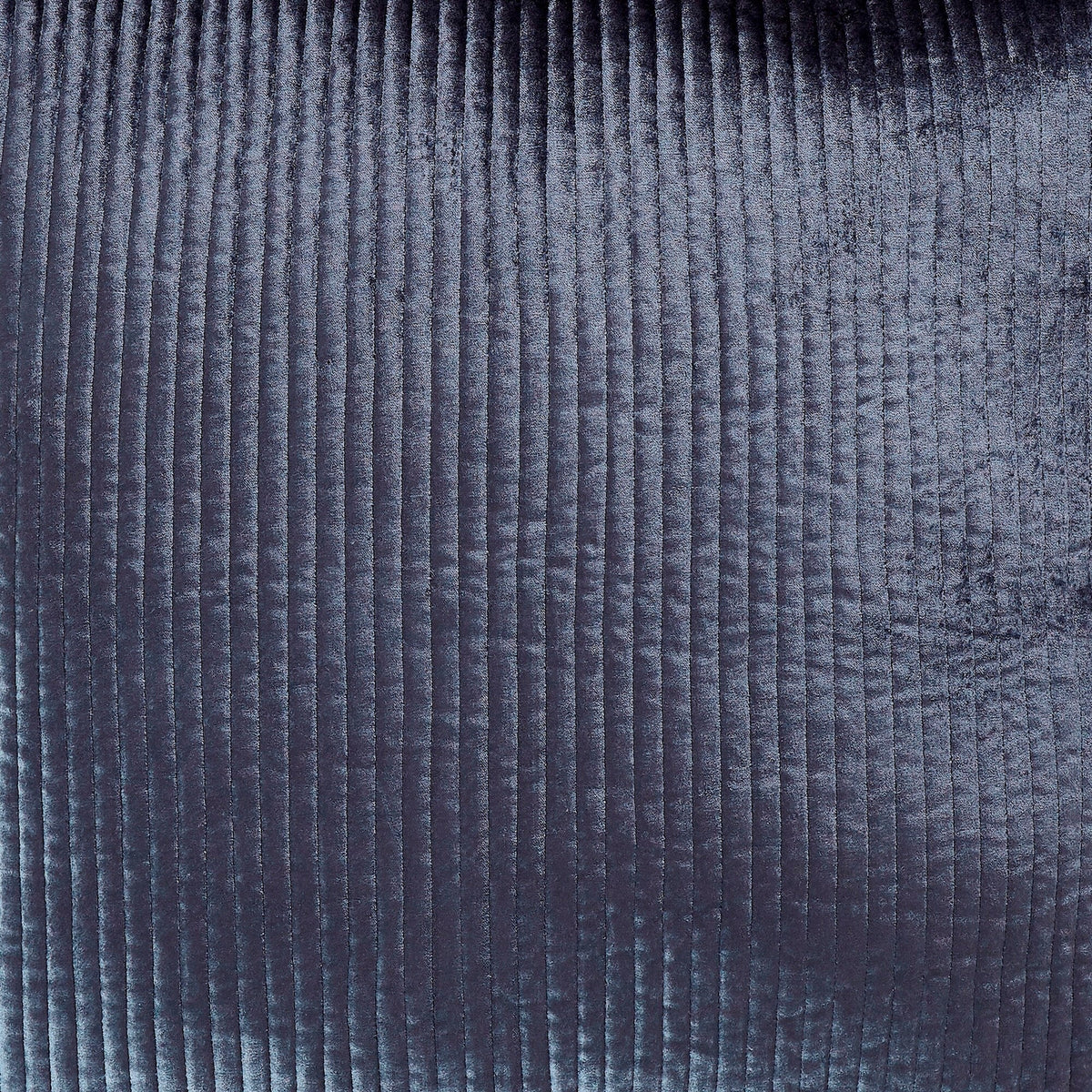 CL-159-9496_1|Dark blue quilted coverlet with a textured, ribbed pattern on a bed in a stylish modern bedroom setting.