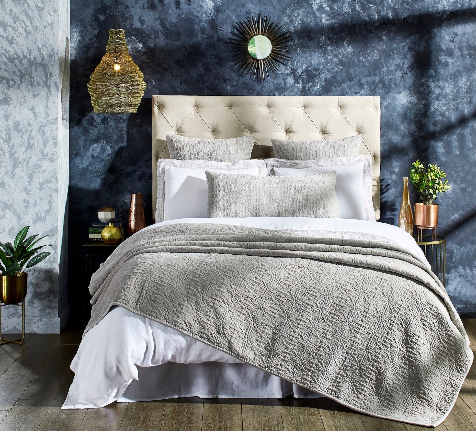 QT-331-9496_3|Modern bedroom with a light grey textured quilted quilt and shams, complementing the plush headboard beautifully.