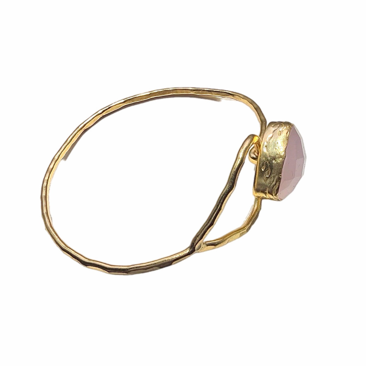 Handmade Gold bracelet with a pink gemstone on a white background-facing-right-side
