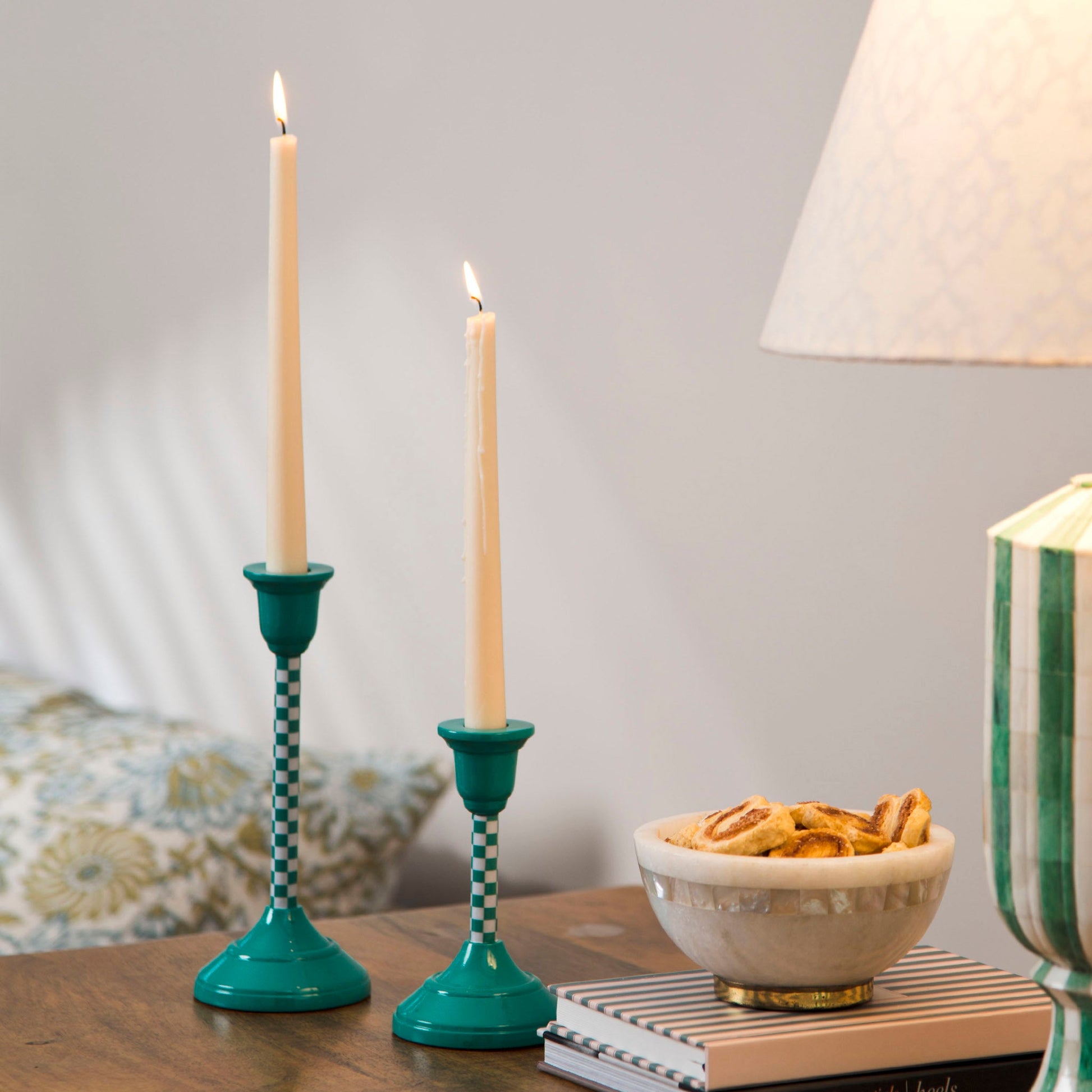 Aluminum taper candle holder with a mint green checkered finish for modern and spring-themed home decor.