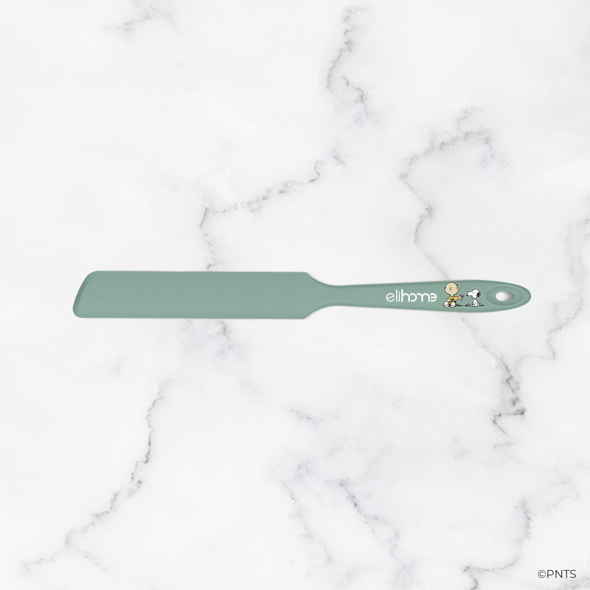 Green spatula with 'elihave' branding on a marble background