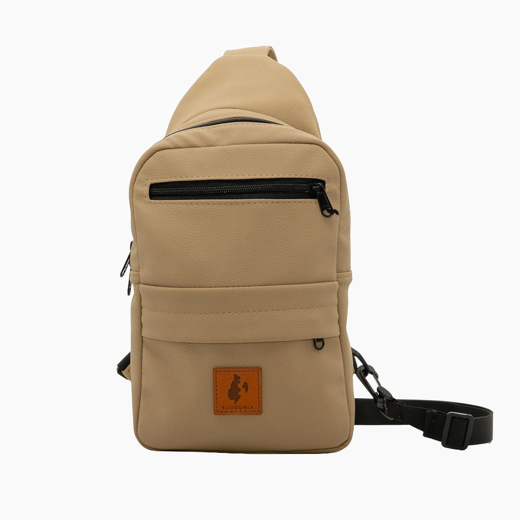 Umoja latte vegan leather sling bag flat lay #color_latte