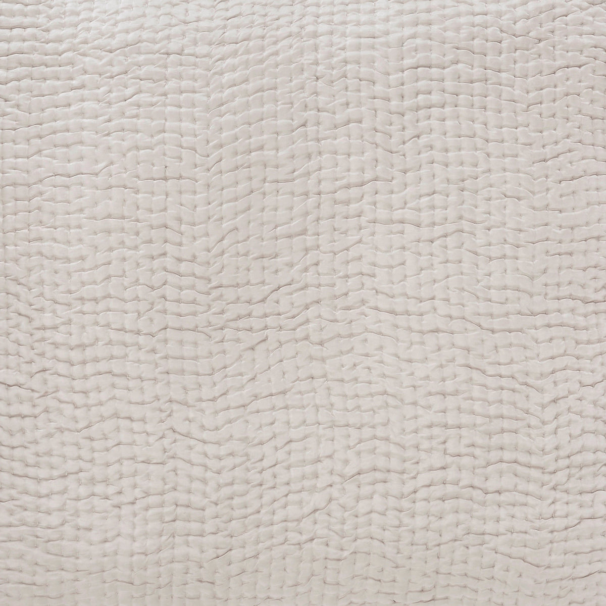 SS-166-2026_2|Detailed close-up of a luxurious light grey quilted coverlet fabric, showcasing its elegant wavy textured pattern. Soft bedding material.