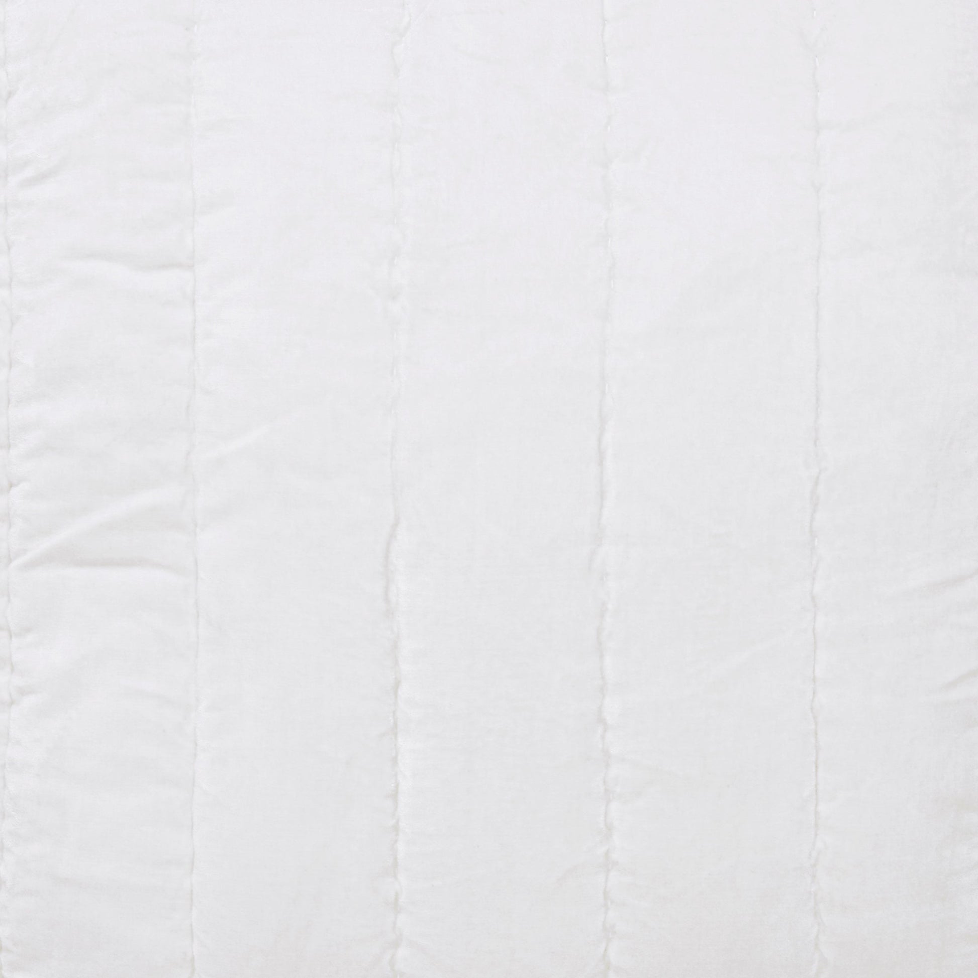 SS-337-2026-LOT1_2|Close-up of white quilted fabric with elegant vertical channel stitching, offering a modern and serene bedding texture.