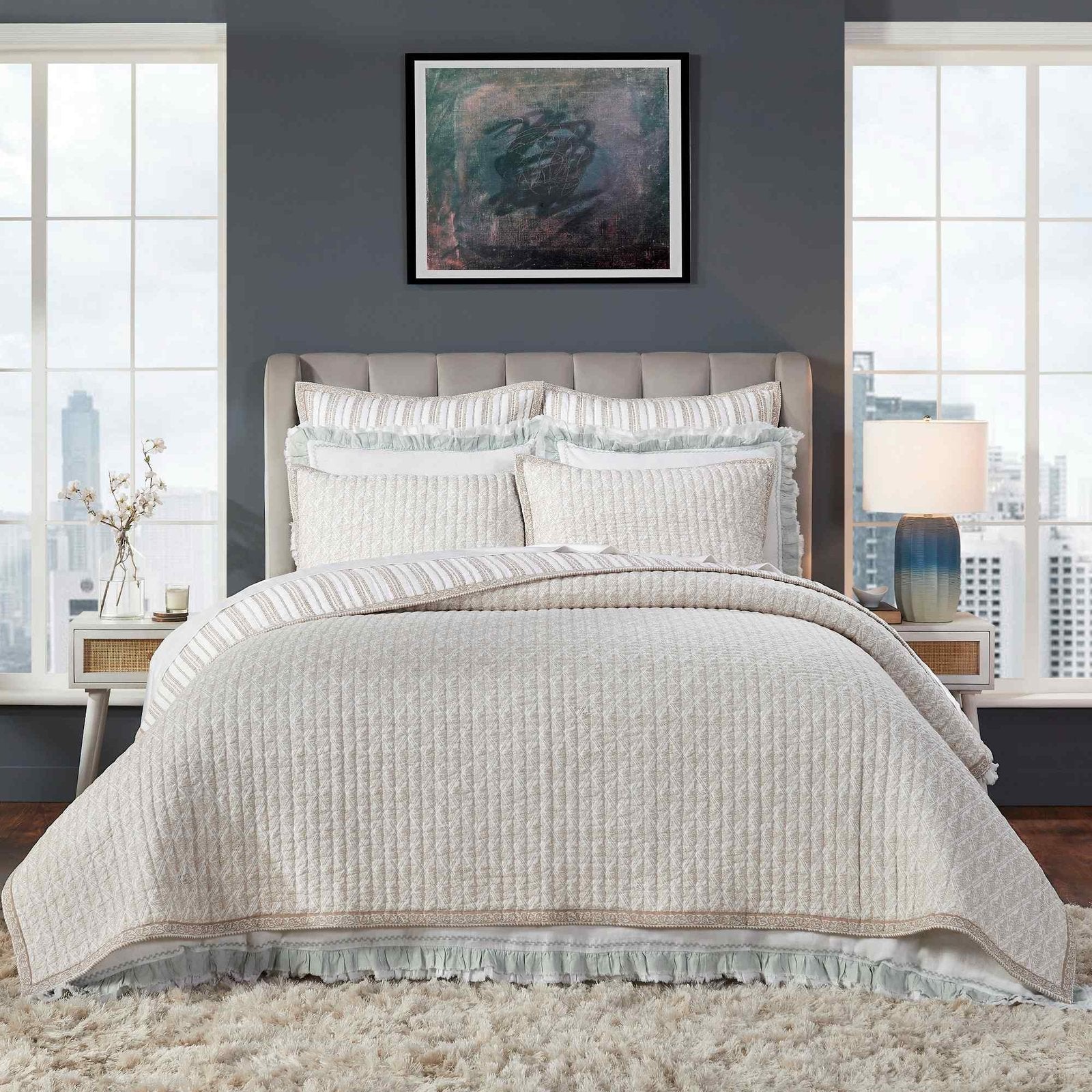 QT-347-X_1|Elegant cream textured quilt bedding set with striped accents and delicate ruffles, creating a cozy and inviting atmosphere in a modern bedroom.
