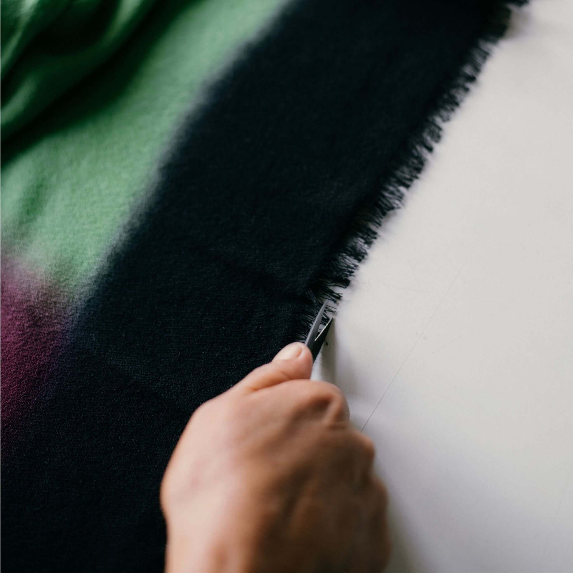 Iris Courtyard Green Purple Hand Woven Cashmere Merino Scarf being handcrafted with care.
