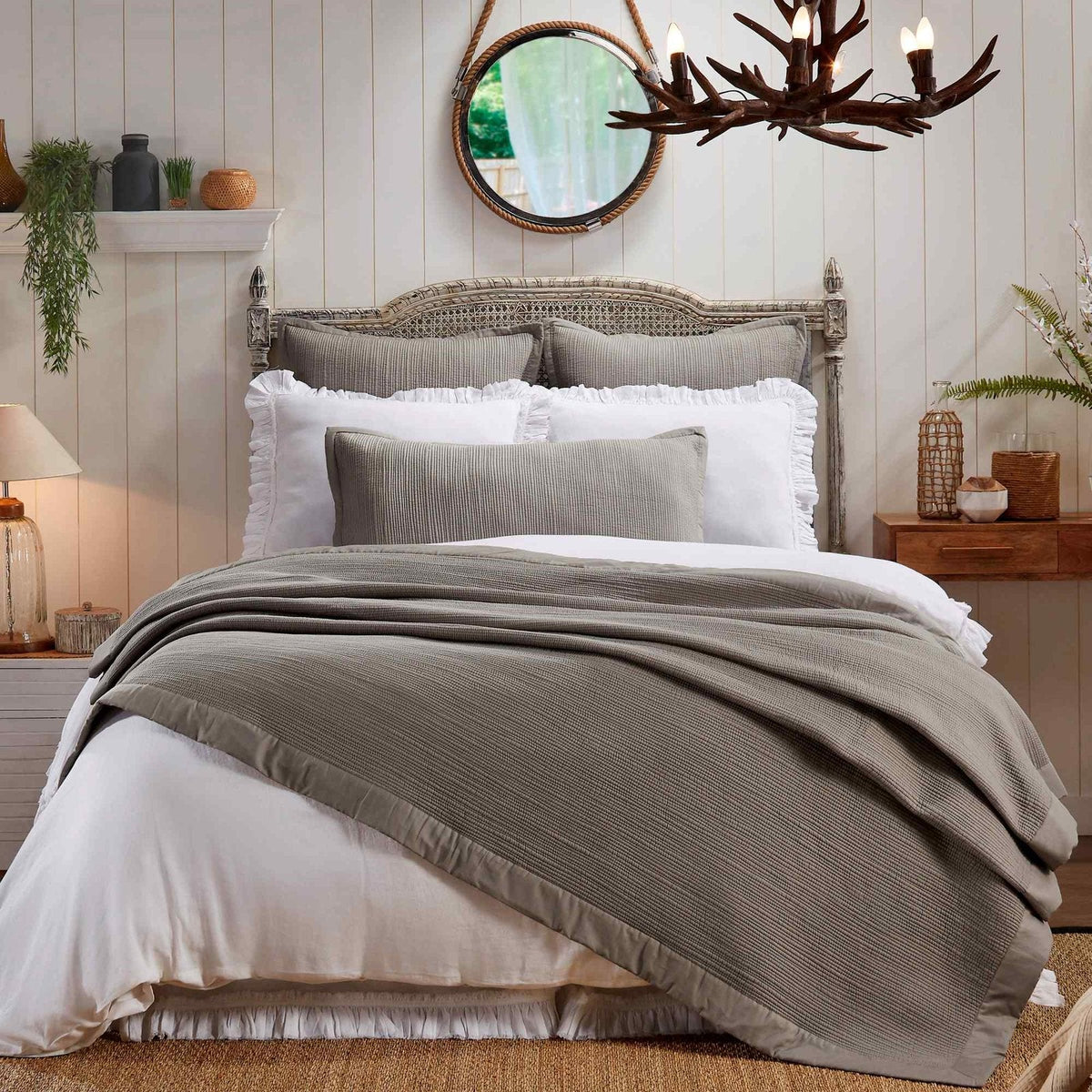 CL-162-11096_1|Serene bedroom featuring a luxurious grey textured coverlet draped across the bed, enhancing modern comfort and style.