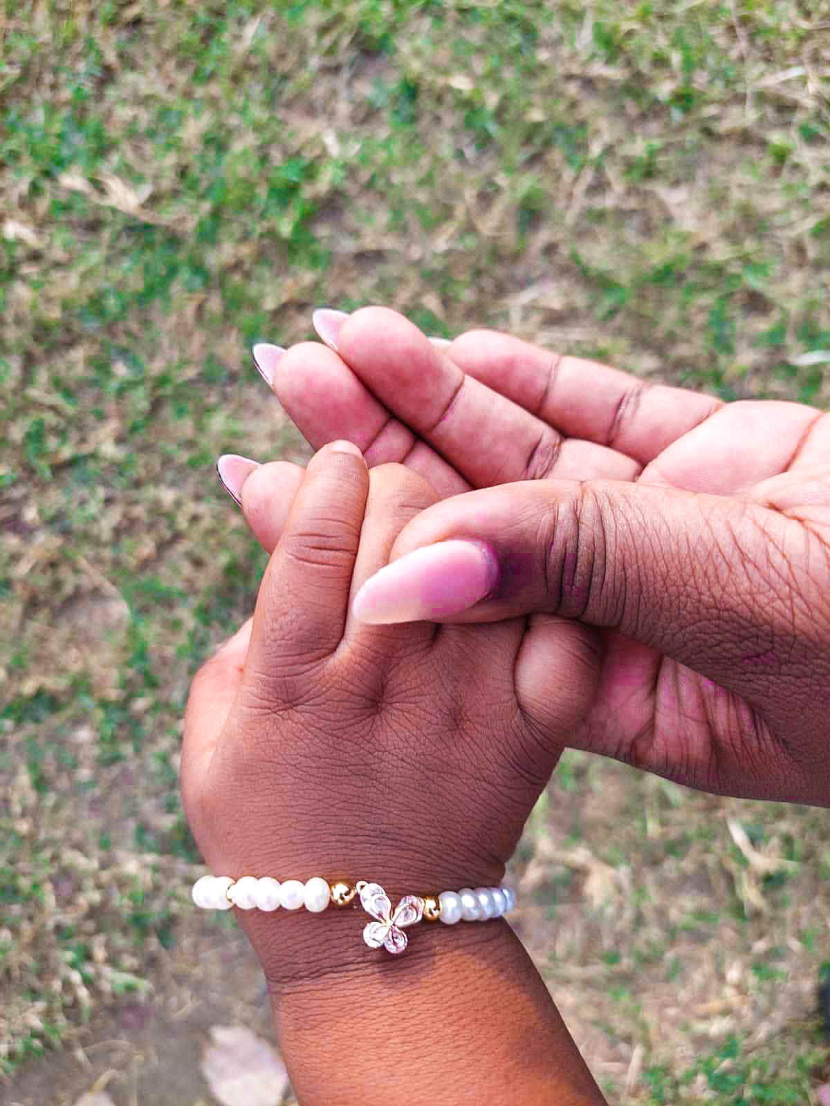 Gold pearl butterfly jewelry modeled