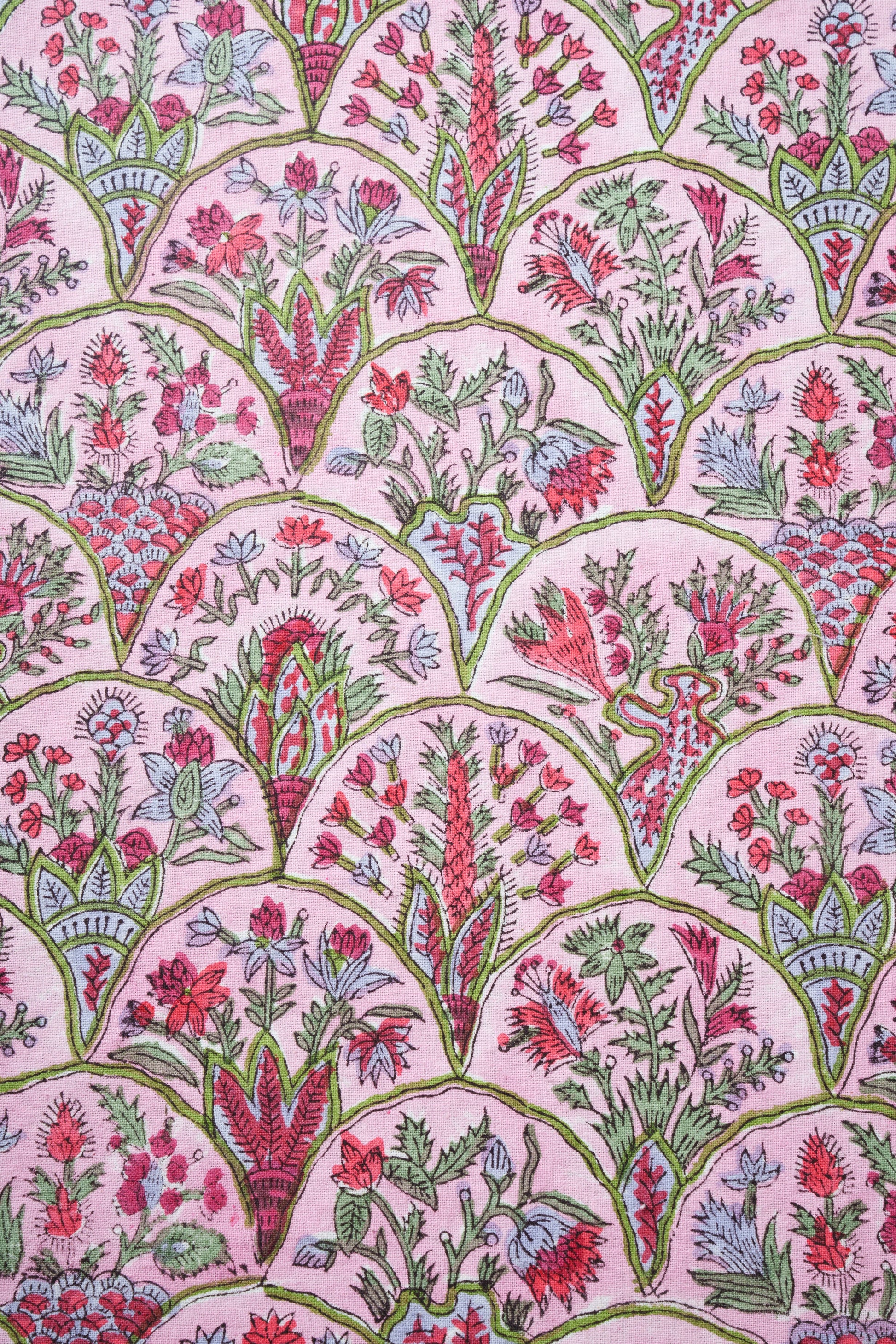 Pink Arch blockprint fabric with colorful floral patterns, green arches, pink background