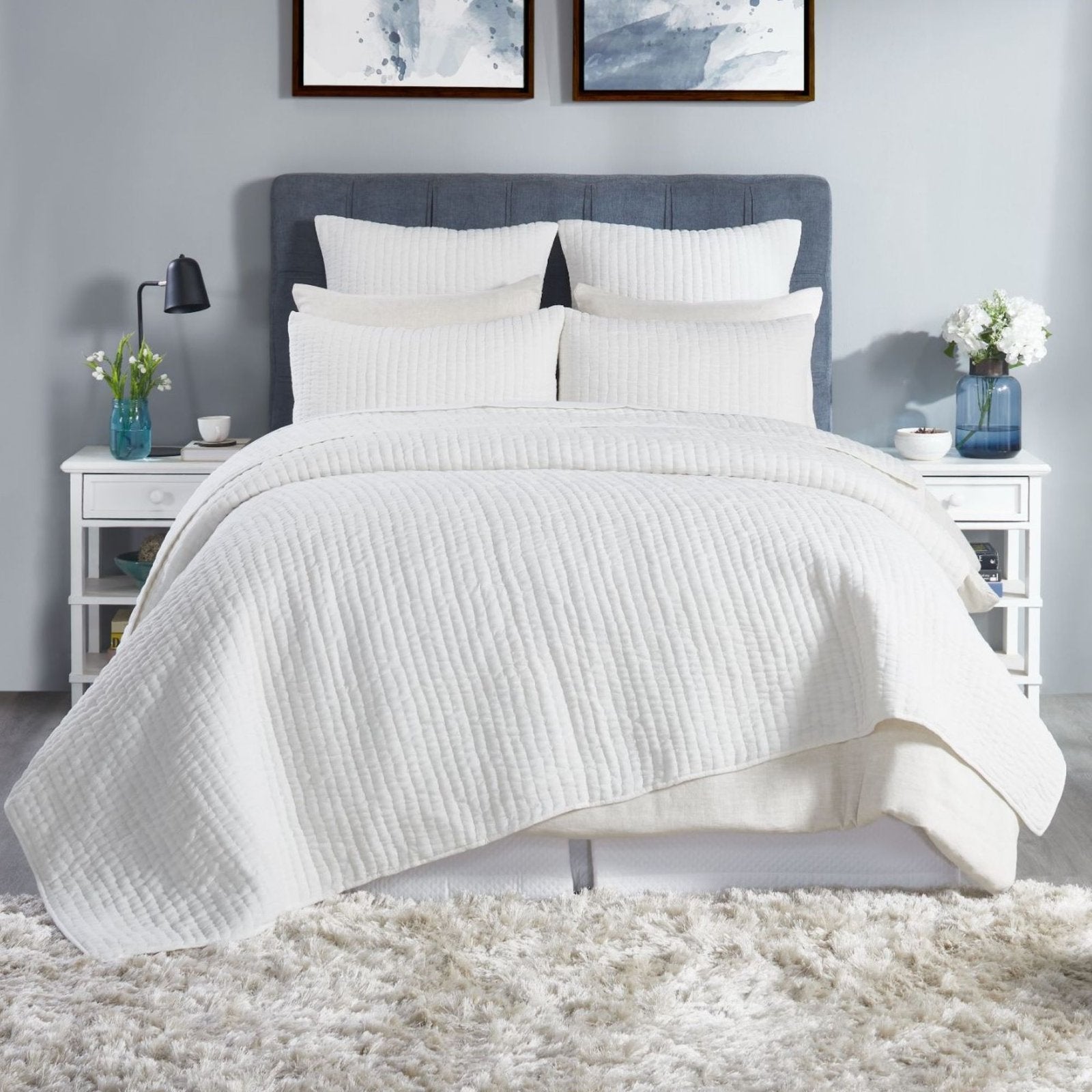 QT-359-9496_1|Crisp white textured quilt set on a bed, providing a fresh, serene look and comfortable, breathable layer.
