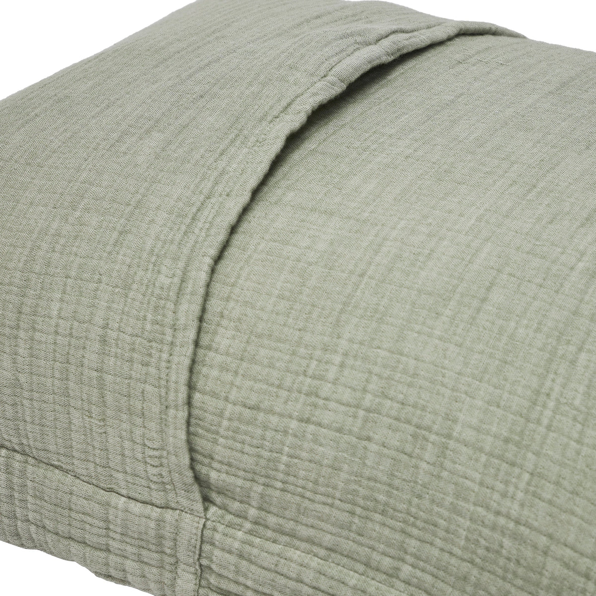ES-051-2626_2|Close-up of sage green textured cotton pillow sham showing envelope closure, part of a soft and inviting duvet cover aesthetic.