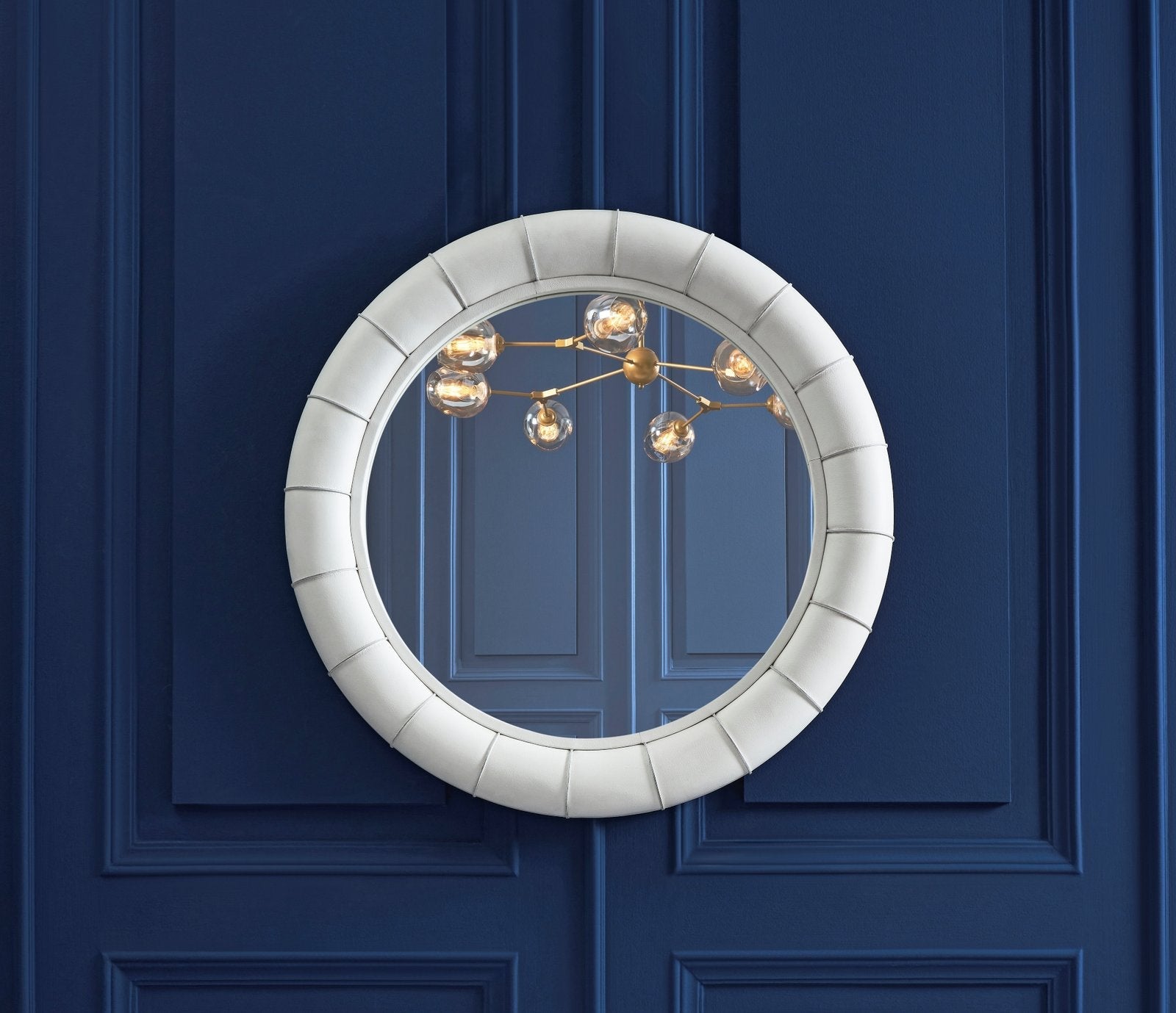 FN-5203-33233_2|Modern white leather-framed round mirror with padded design. Elegant contemporary decor for stylish living spaces.