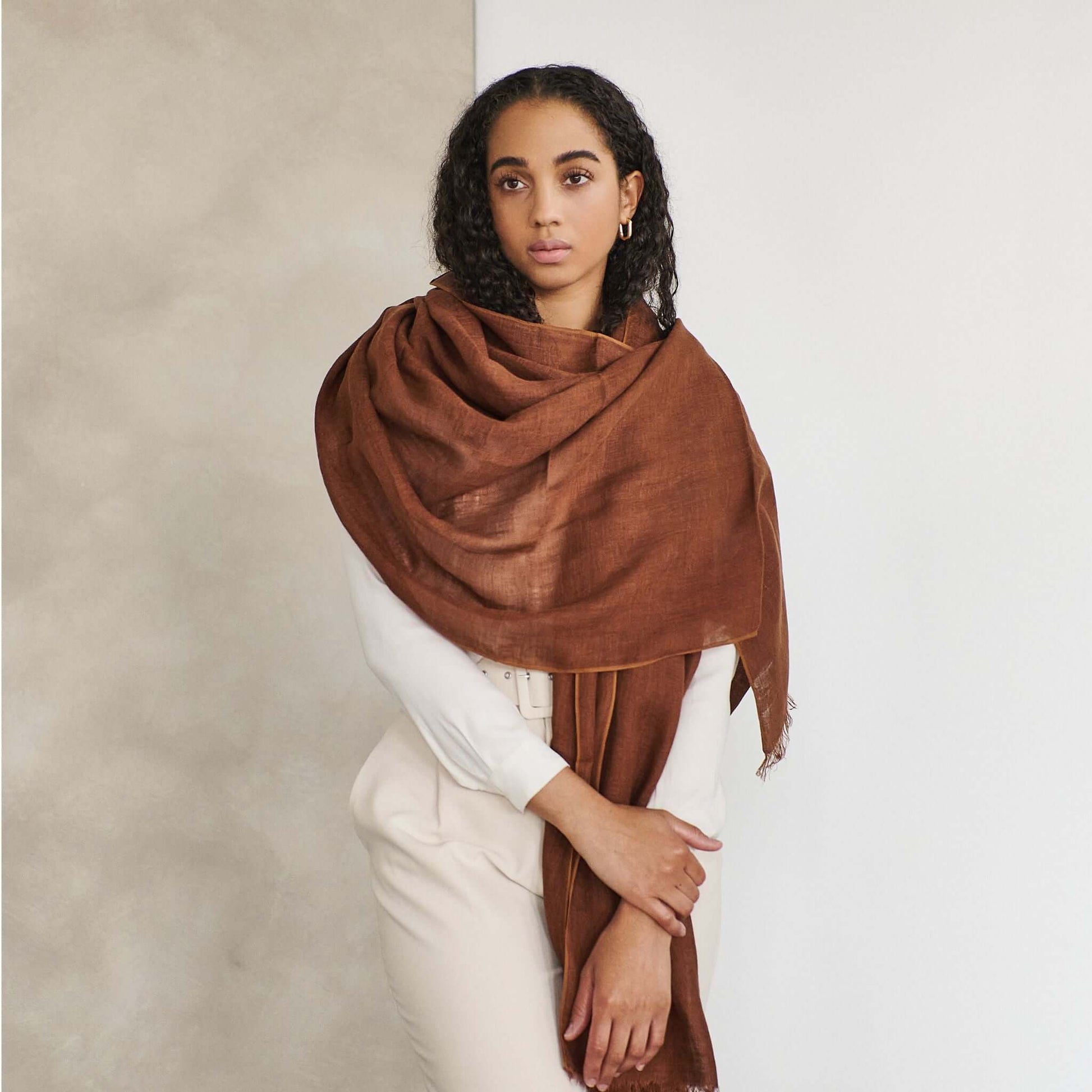 Coco Brown Hand Woven Linen Silk Blend Scarf elegantly styled on a model, showcasing its soft texture and versatile appeal.
