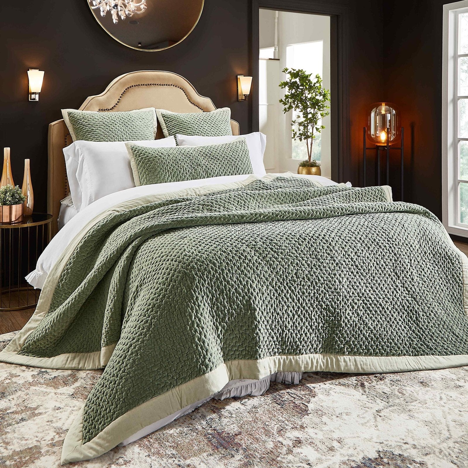 QT-328-DUP-X_1|Elegant olive green quilt with a textured popcorn stitch pattern and contrasting light cream border, styled on a bed.