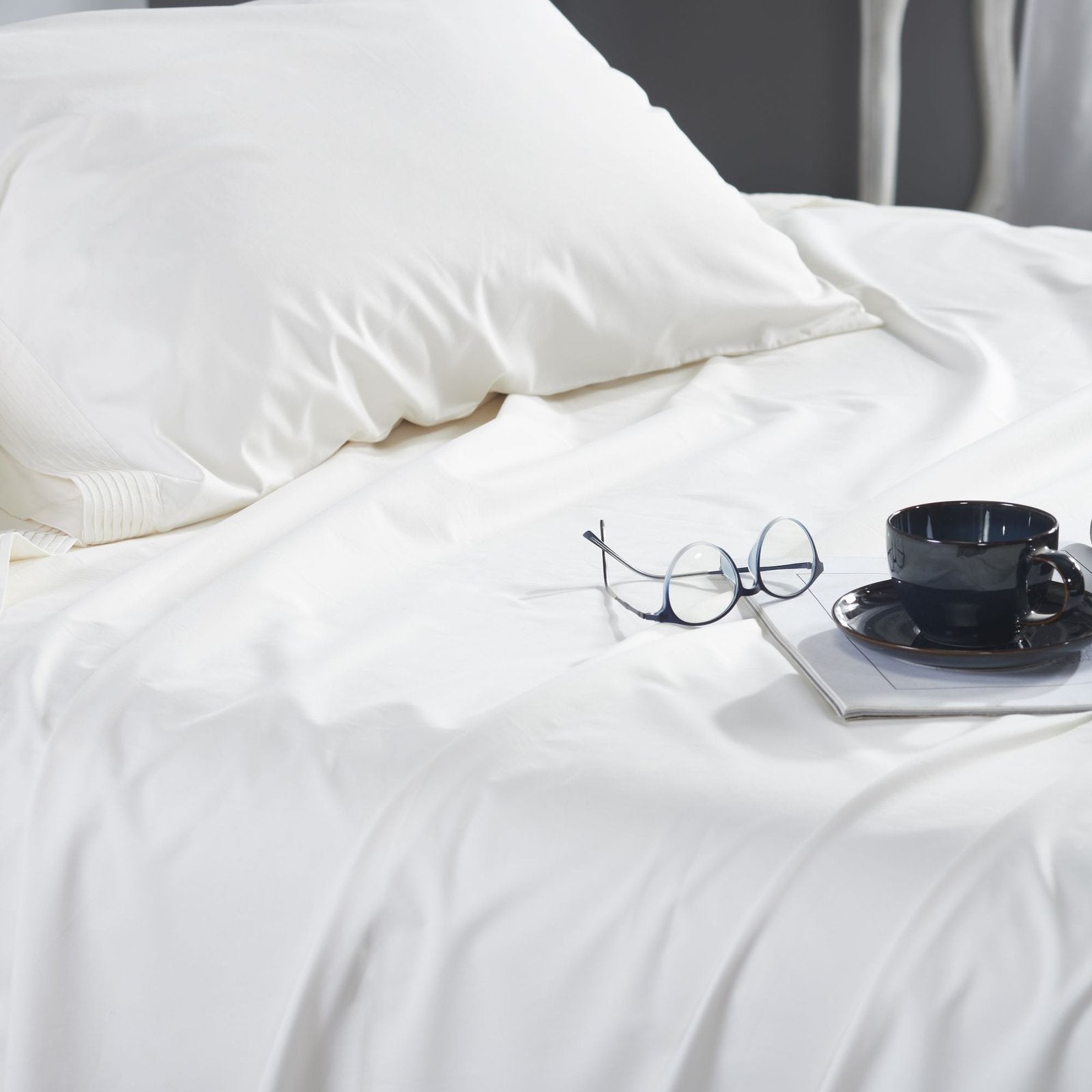QSS-522-6080_3|Crisp white 100% cotton sheets with elegant pleated details, offering breathable comfort and a sophisticated bedroom style.