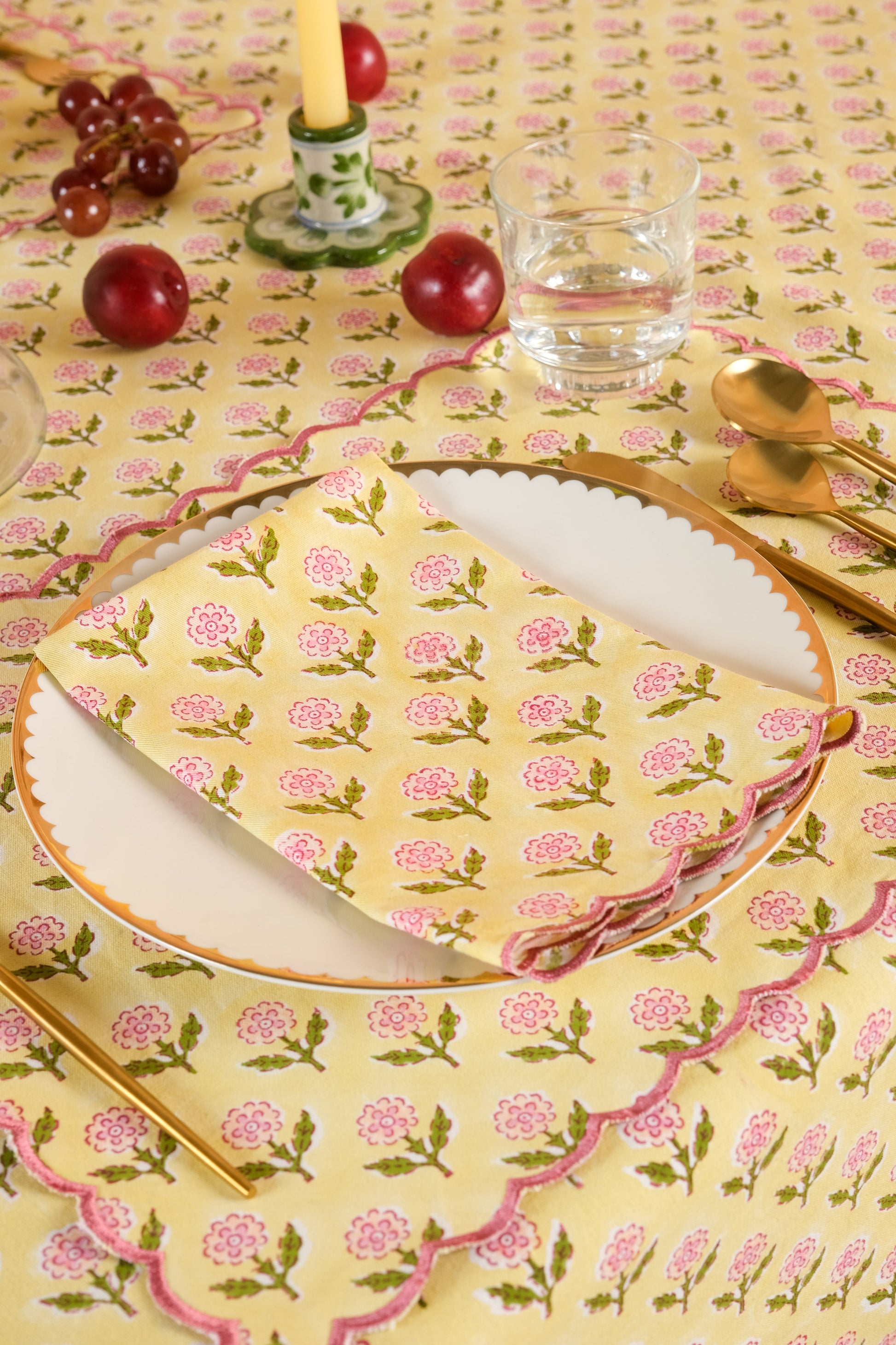 Inner Child butter yellow scallop-edged embroidered blockprint placemat on decorative table