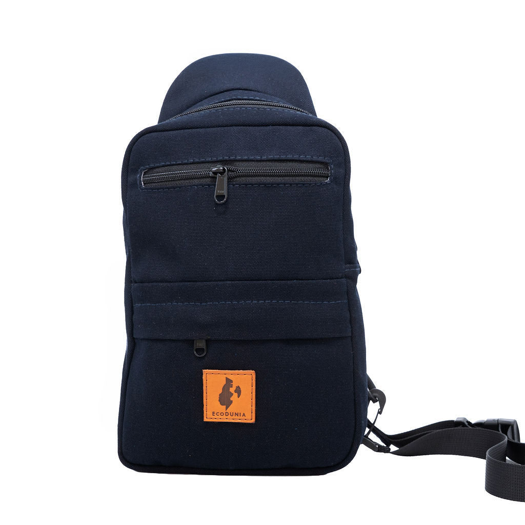 Umoja navy blue canvas sling bag flat lay #color_navy-blue