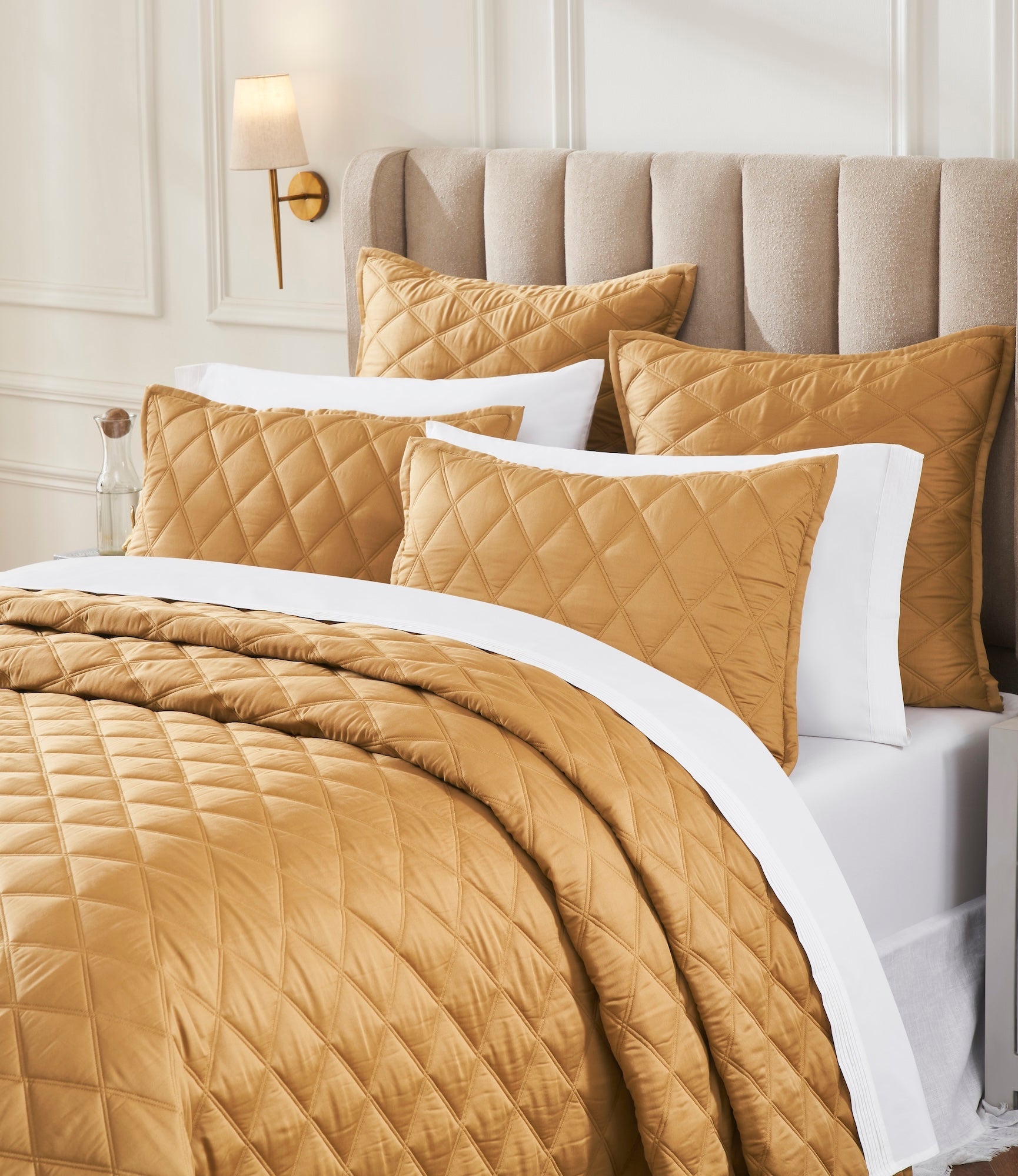 CL-260-9496_3|Golden bronze quilted coverlet and decorative shams showcasing a diamond pattern, perfect for an upscale, inviting bed.
