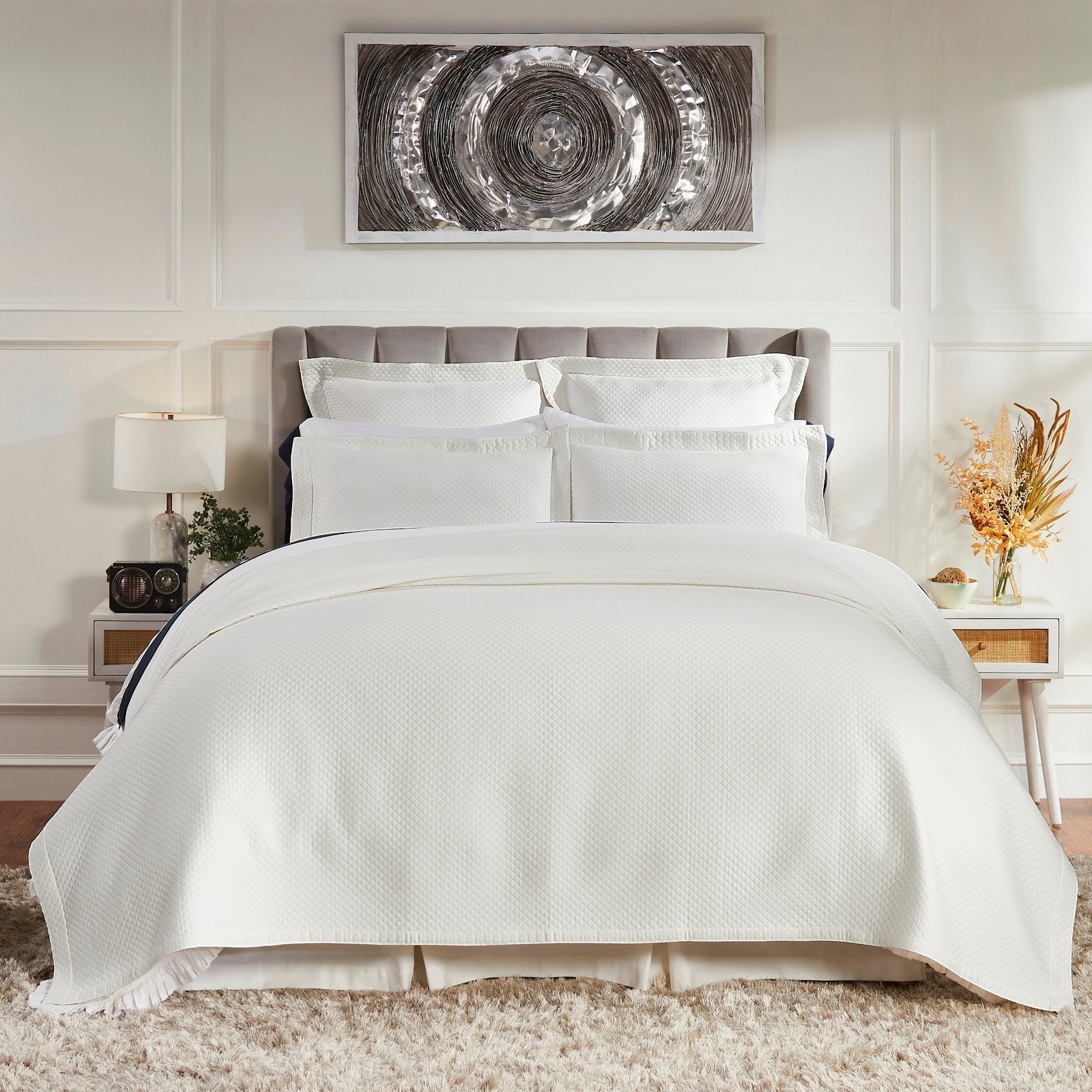 CL-189-11096_1|Elegant white quilted coverlet set with matching shams, gracing a modern grey upholstered bed in a stylish bedroom.