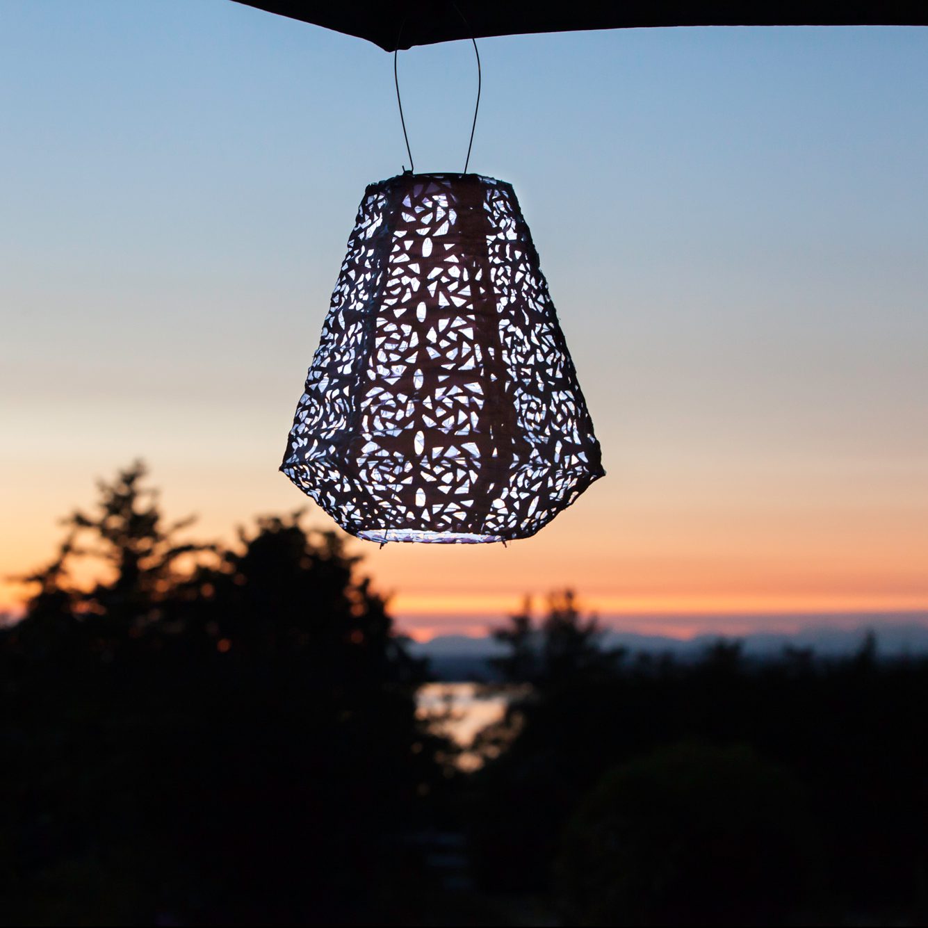 Soji Stella Prism Tyvek Solar Lantern glowing at night