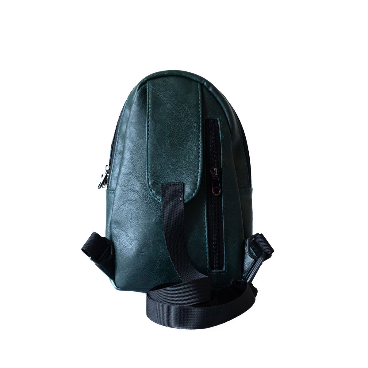 Buru forest green vegan leather sling bag flat lay #color_forest-green