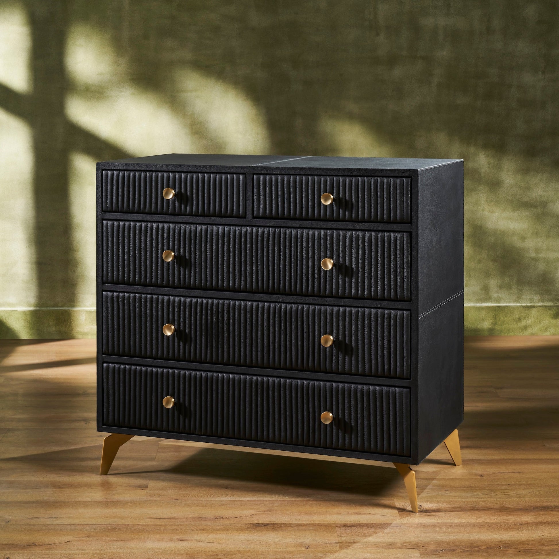 FN-5217-482036_2|Stylish black ribbed leather dresser with golden pulls and tapered legs, a contemporary piece for spacious bedroom storage.