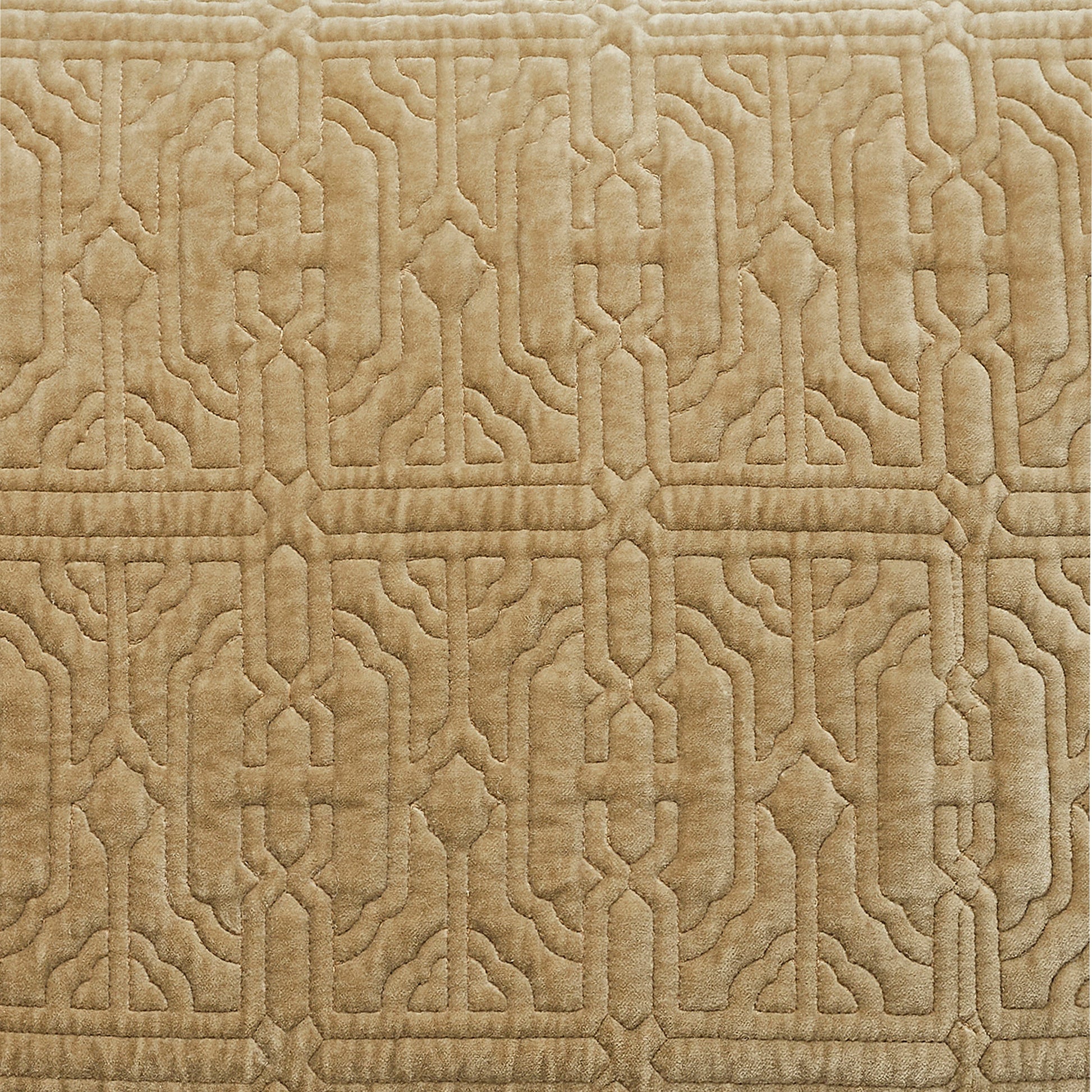 DE-377-3137_5|Close-up view of luxurious light brown quilted velvet fabric showcasing intricate geometric pattern detail and texture.
