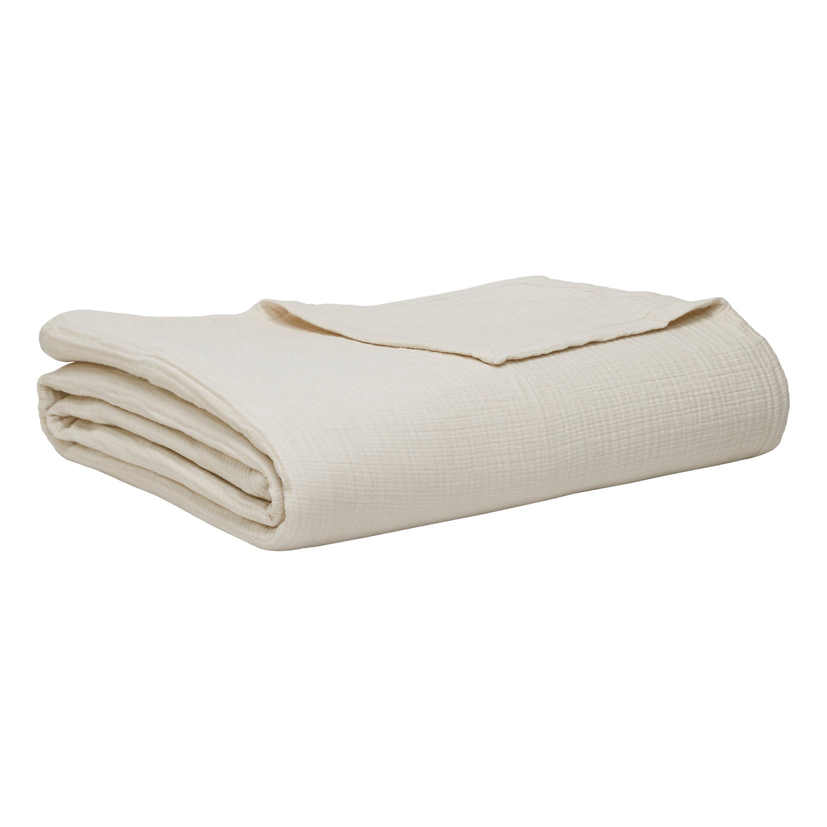 BL-862-11096_8|Textured cream cotton blanket, neatly folded and partially draped, providing soft, breathable comfort for versatile bedroom styling.