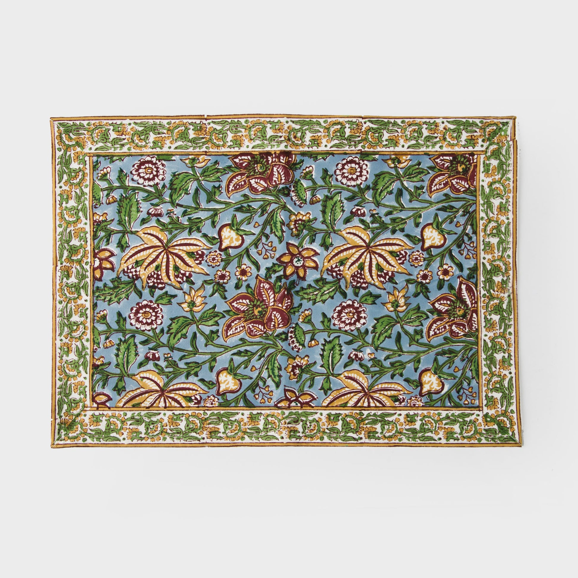 Close-up of the vibrant green floral block print
