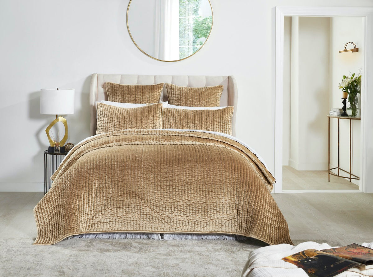 QT-362-9496_2|Elegant gold velvet quilt with a distinct textured pattern, gracefully covering a bed, enhancing a bright bedroom aesthetic.