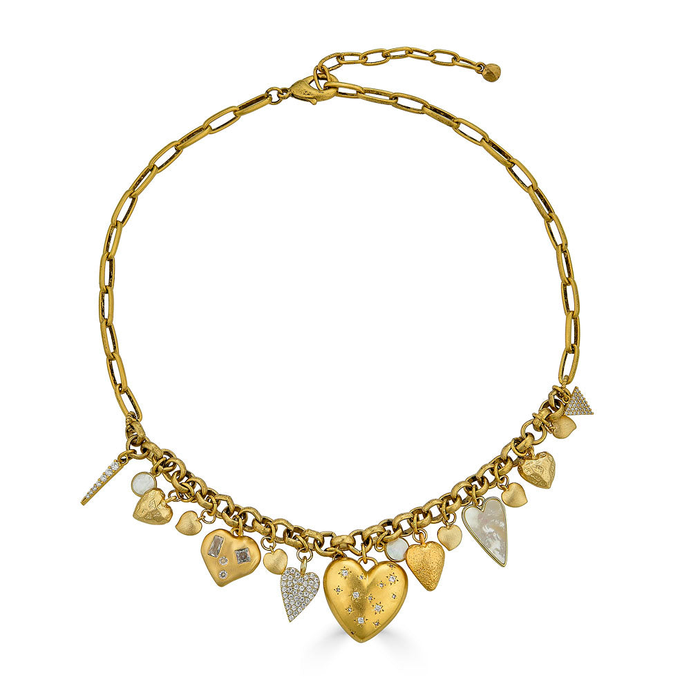 Handmade gold heart necklace with oversized sculptural heart charm, styled for everyday wear.