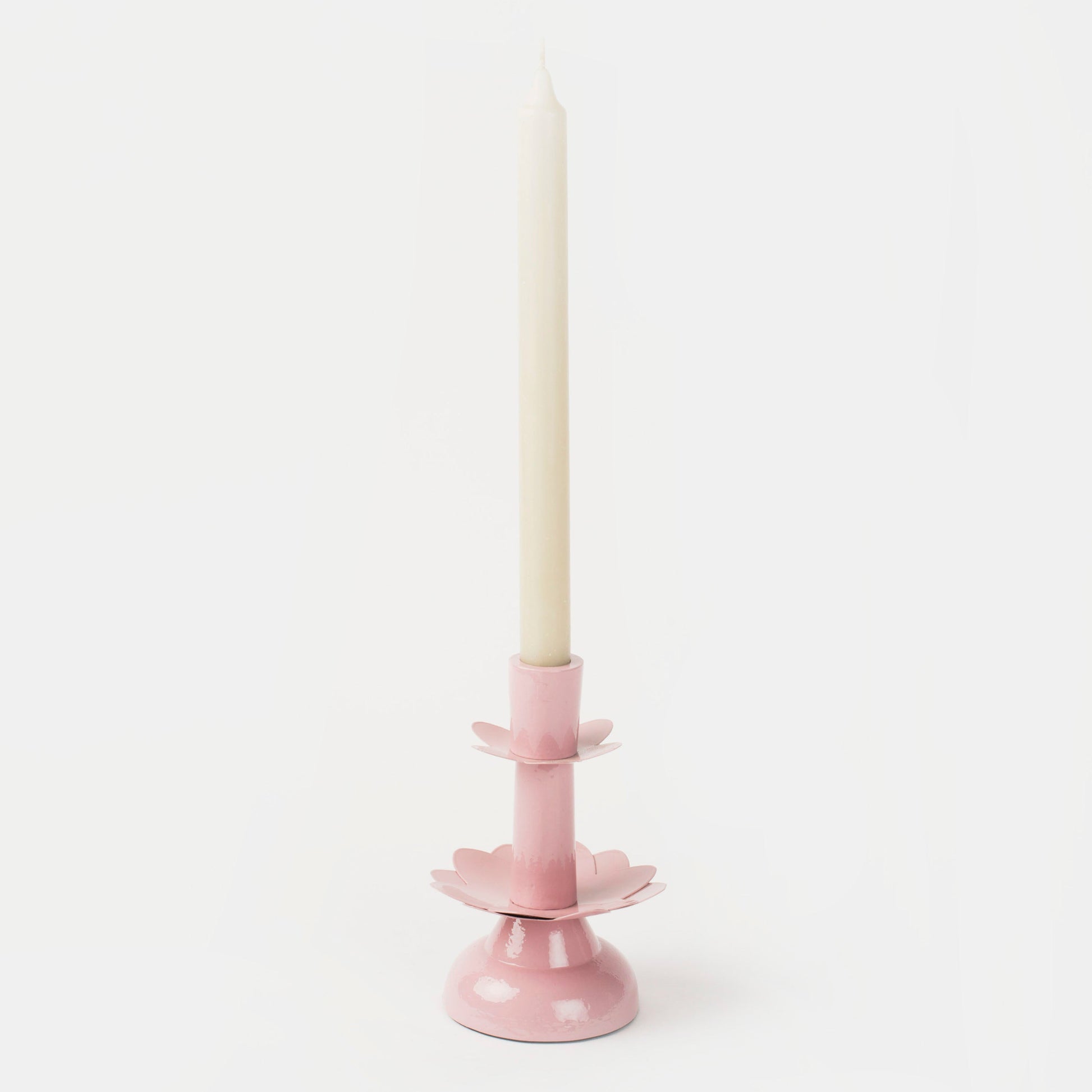 Elegant lotus-shaped taper holder in a soft blush pink, perfect for a feminine or spring-themed tablescape.