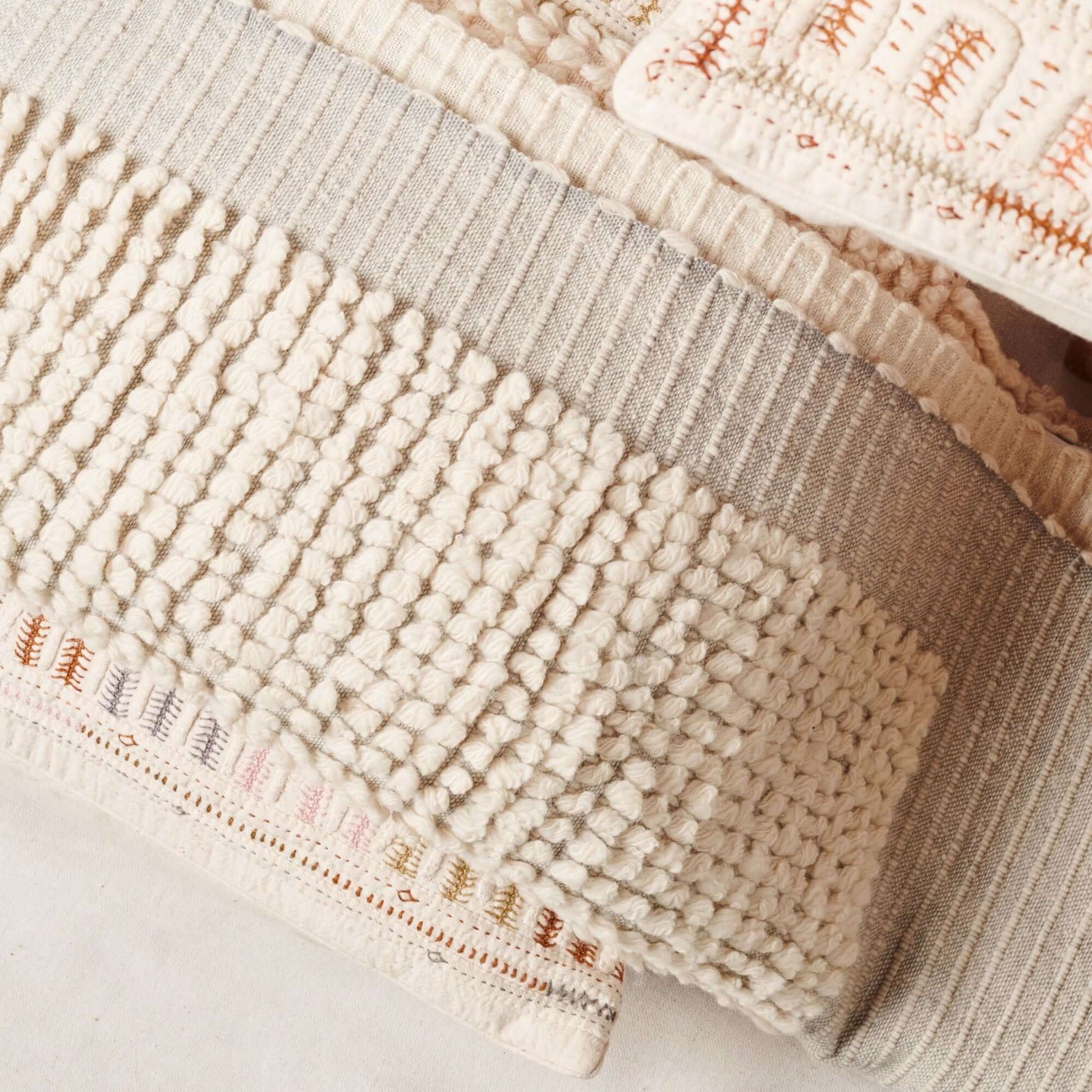 Butterscotch White Handloom Textured Plush Merino Throw showcasing luxurious handwoven textures and unique patterns.