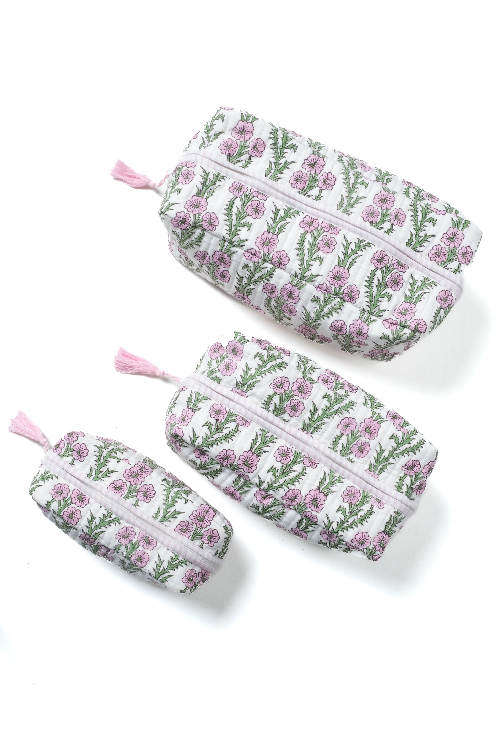 Set of lilac pink blockprint makeup bags with forget-me-not floral pattern, pink tassels