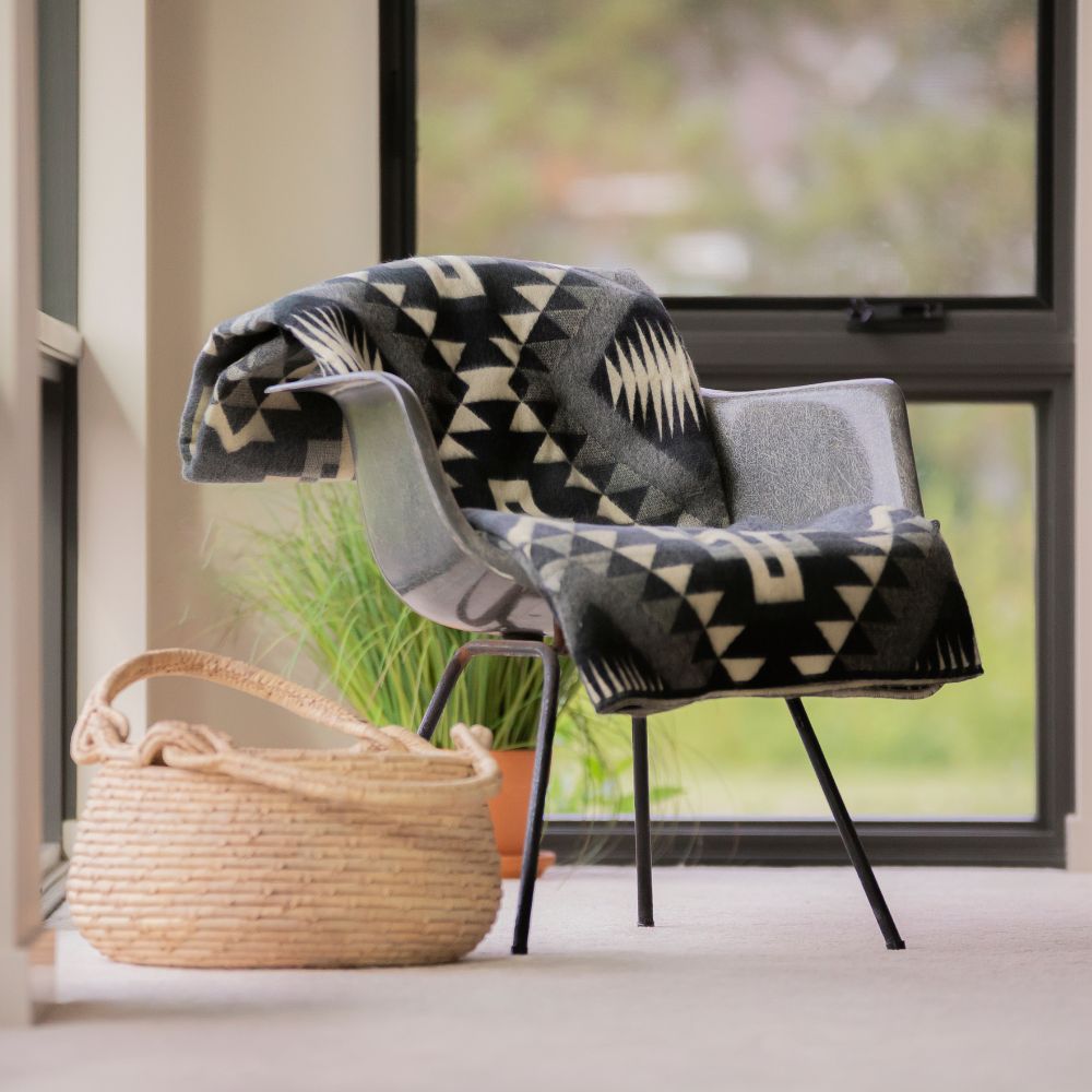 Black handwoven throw with geometric pattern