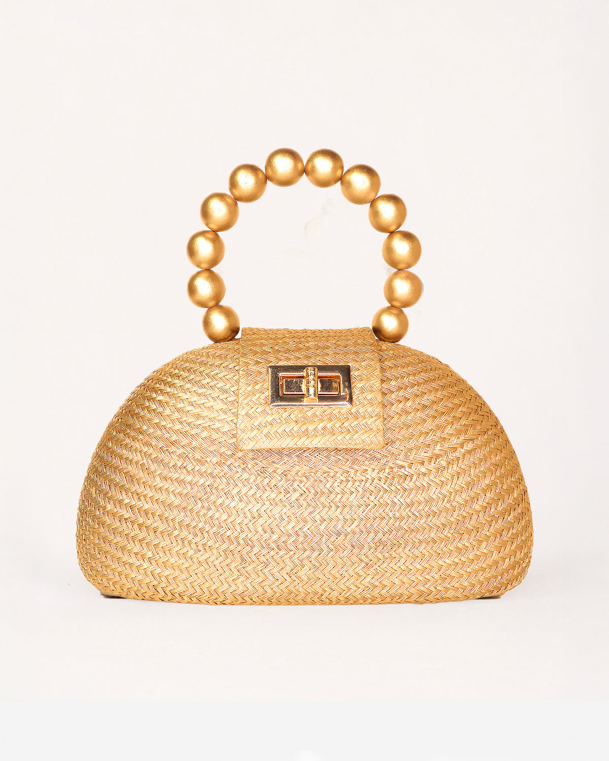 The Orla gold woven straw half-moon bag with pearl beaded handle, front view