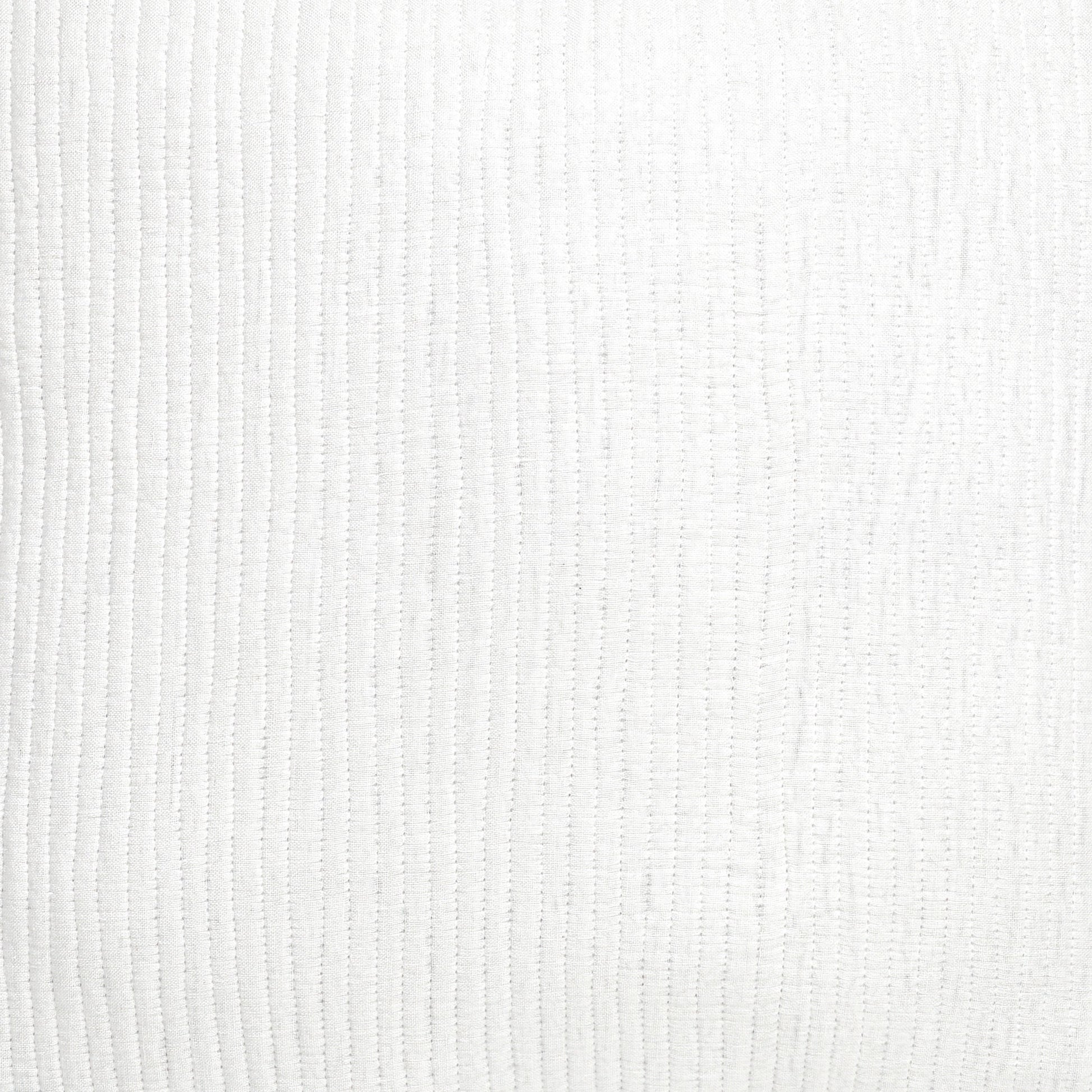 SS-196-2026_2|Detailed view of pristine white linear quilted coverlet texture, providing subtle elegance for a modern bedroom.