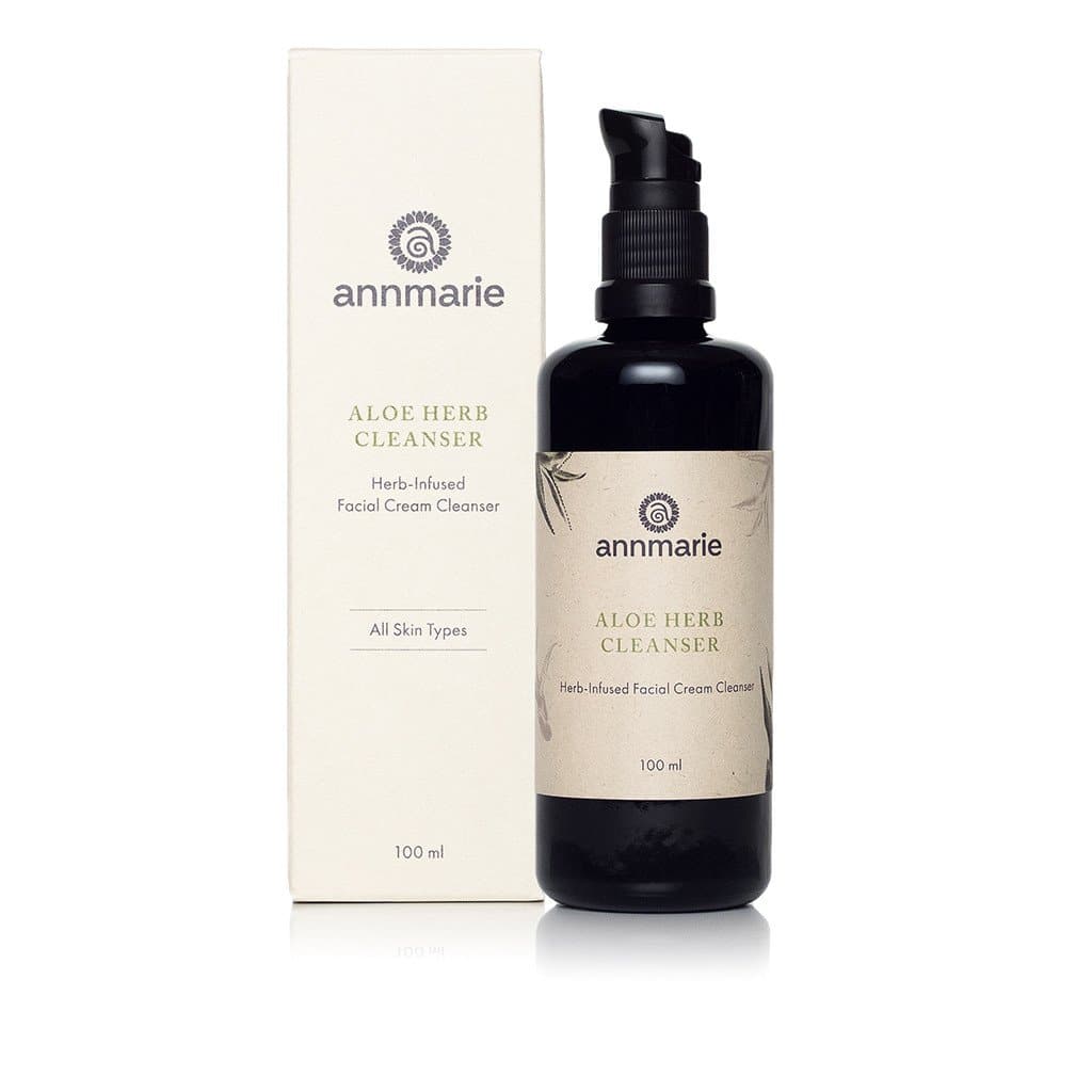 Annmarie Aloe Herb Cleanser herb-infused facial cream cleanser bottle with packaging for all skin types featured on with a white plain background.
