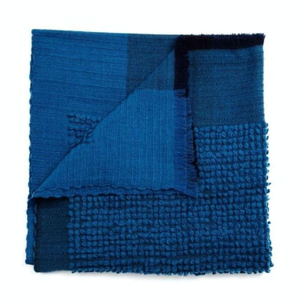 Macaroon Midnight Dark Blue Textured Merino Handloom Throw displayed in dark blue hues with varied textures.