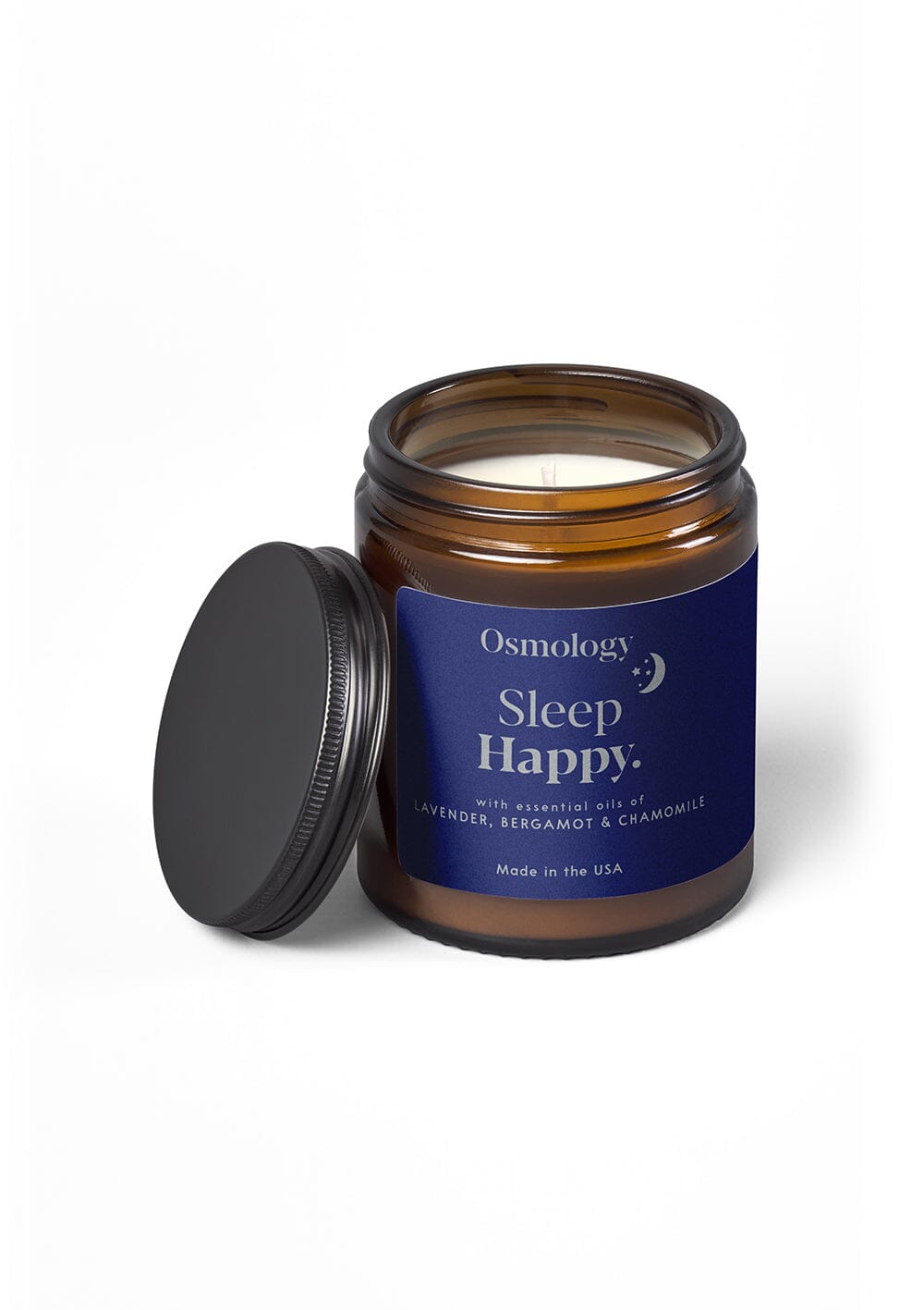 Osmology Sleep Happy jar candle with open lid on cream background
