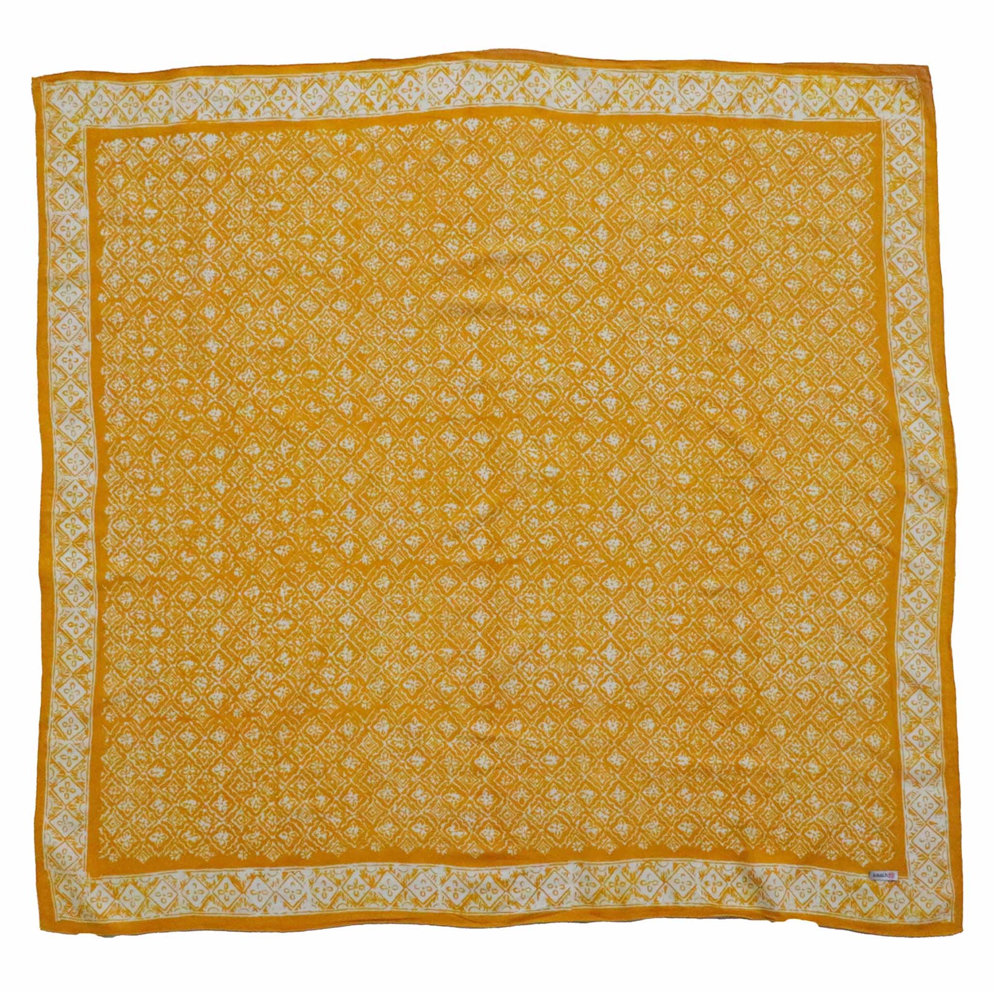 Yellow bandana with white floral patterns on a white background