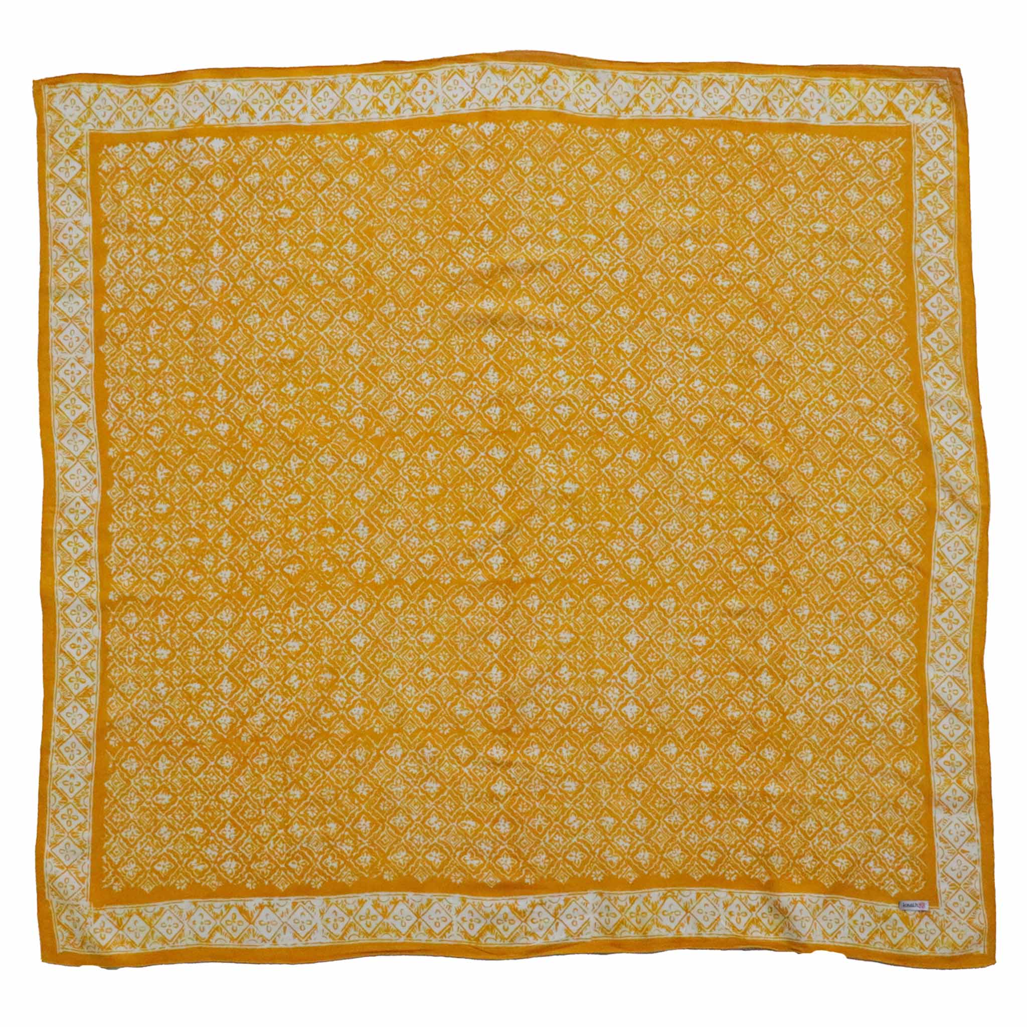 Yellow bandana with white floral patterns on a white background