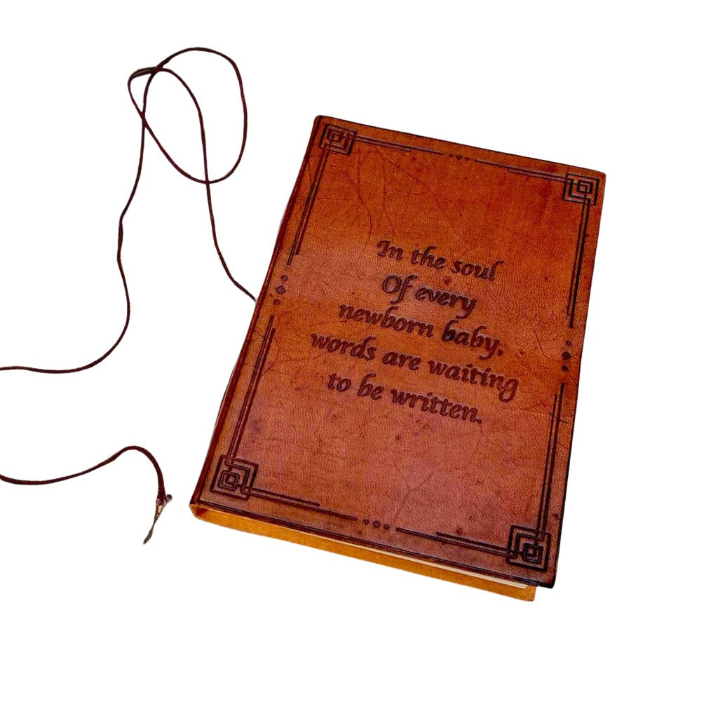 Leather-bound journal embossed with the quote “In The Soul Of Every New Born Baby Words Are Waiting To Be Written - perfect for documenting new borns progress, baby diary